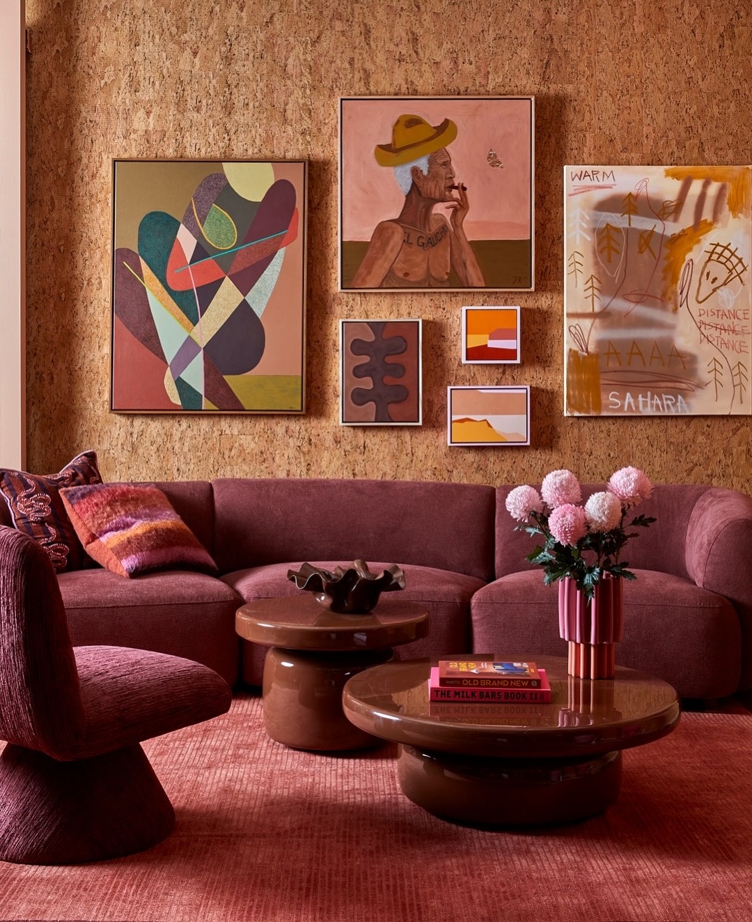 4. Warm Plum Upholstery with a Textured Backdrop