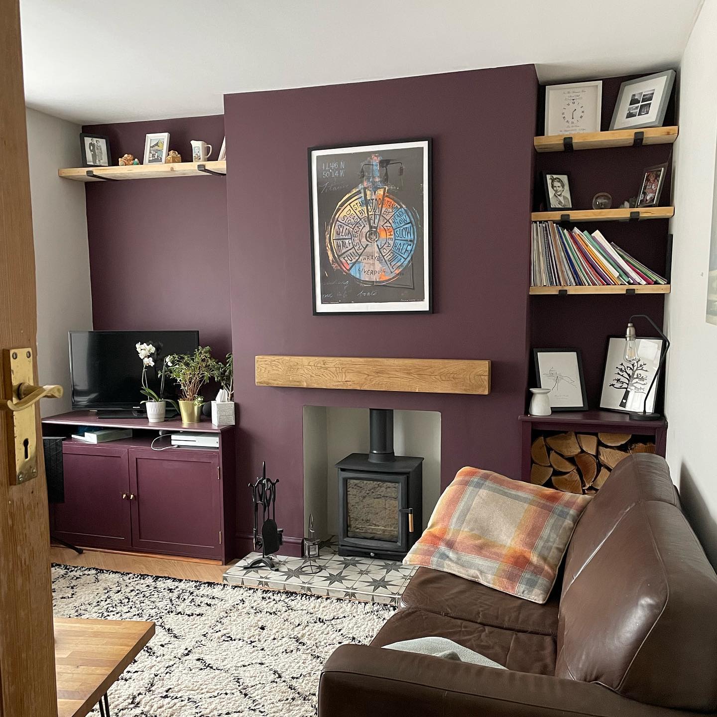 13. Break Up Plum Paint with Warm Wood Shelves