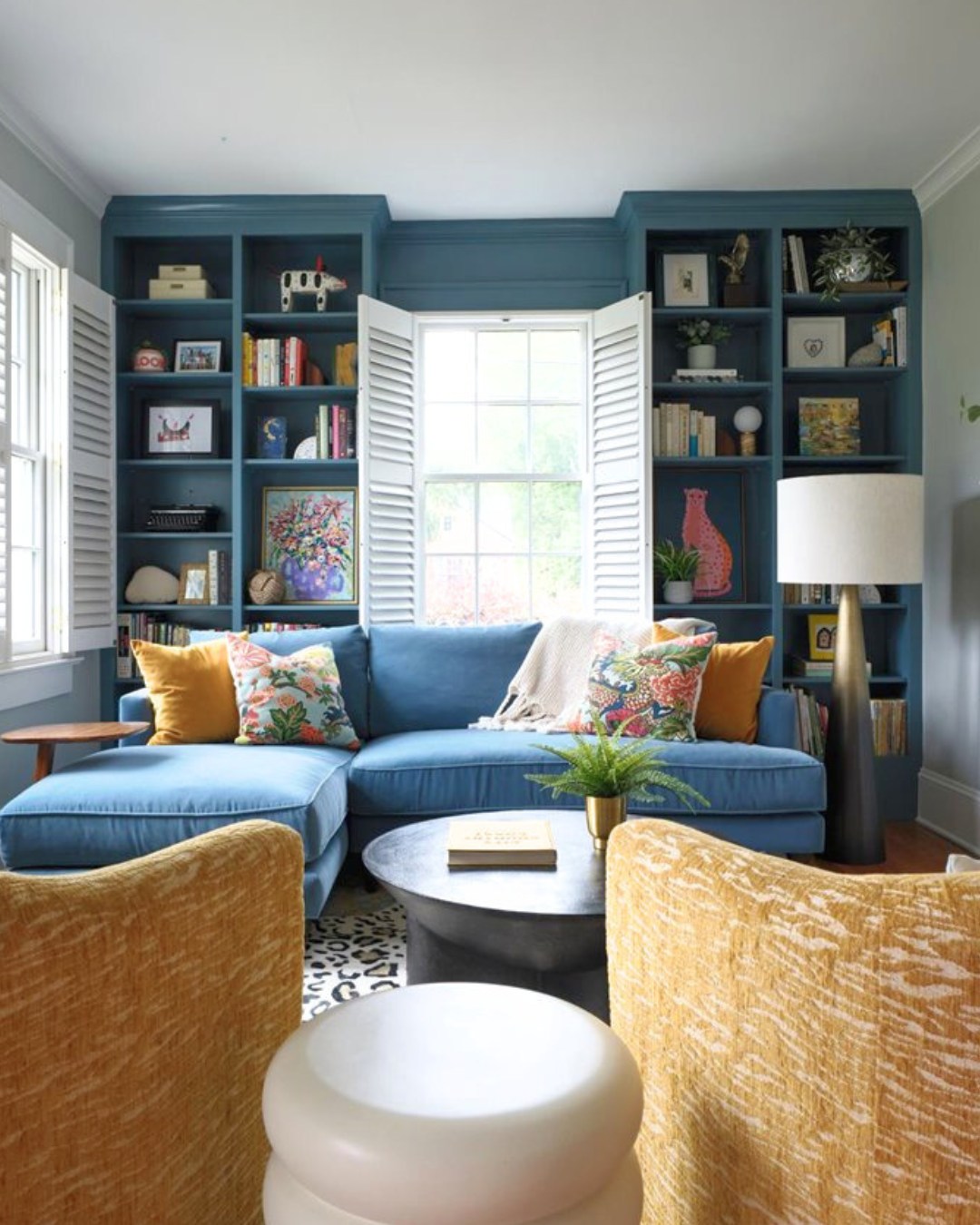 8. Balance Blue Shelves With Golden Accent Chairs