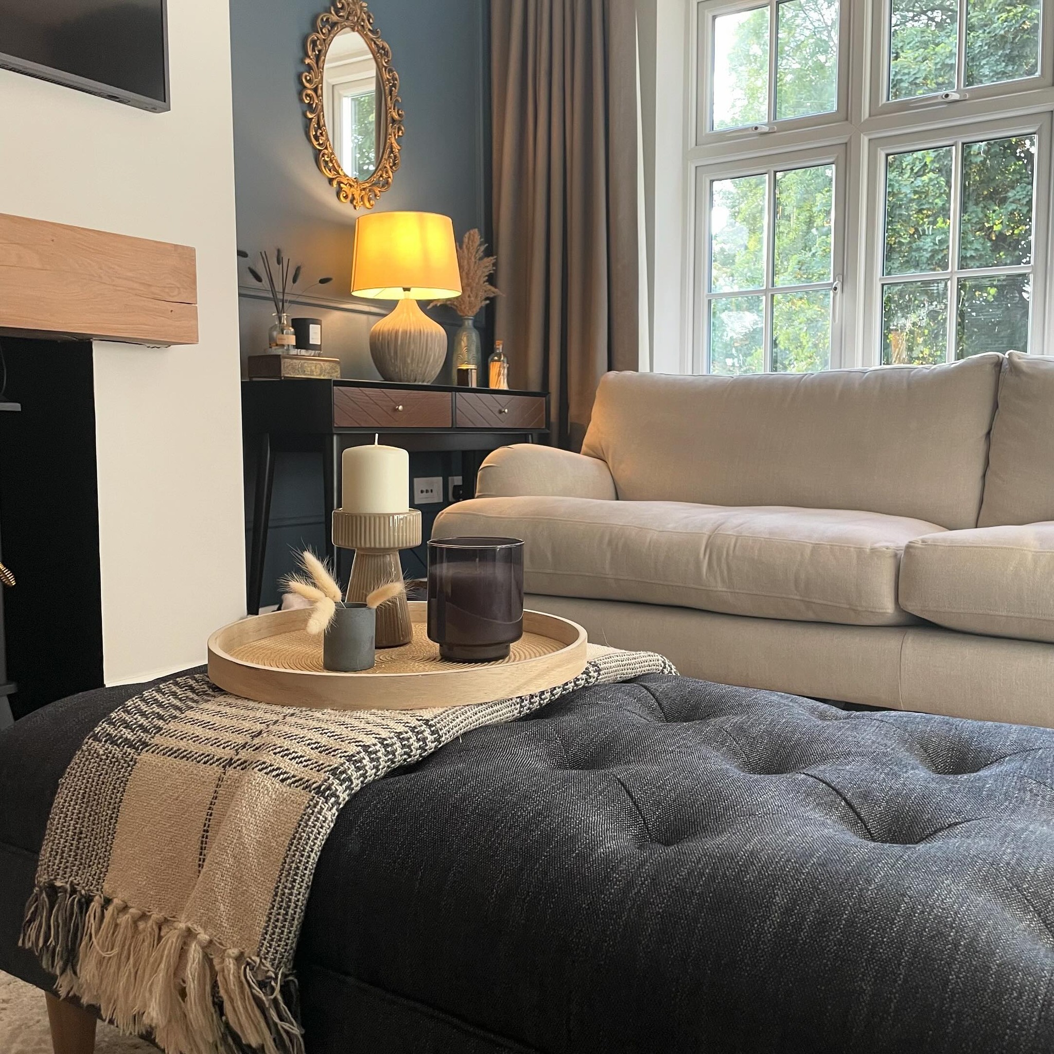20. Anchor a Pale Sofa With a Dark Tufted Ottoman
