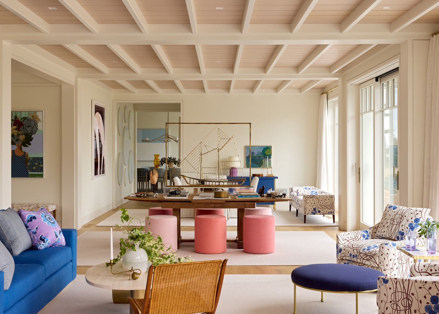 2. Repeat Coral and Pink Accents Around Blue Seating