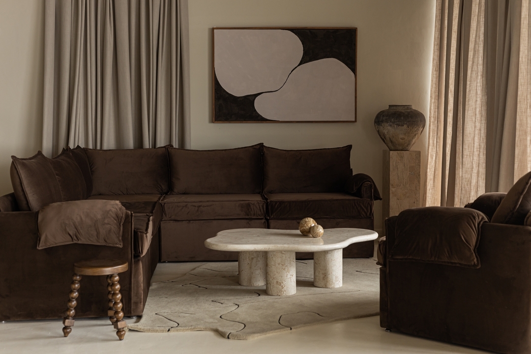 19. Brighten Dark Seating with a Pale Sculptural Table