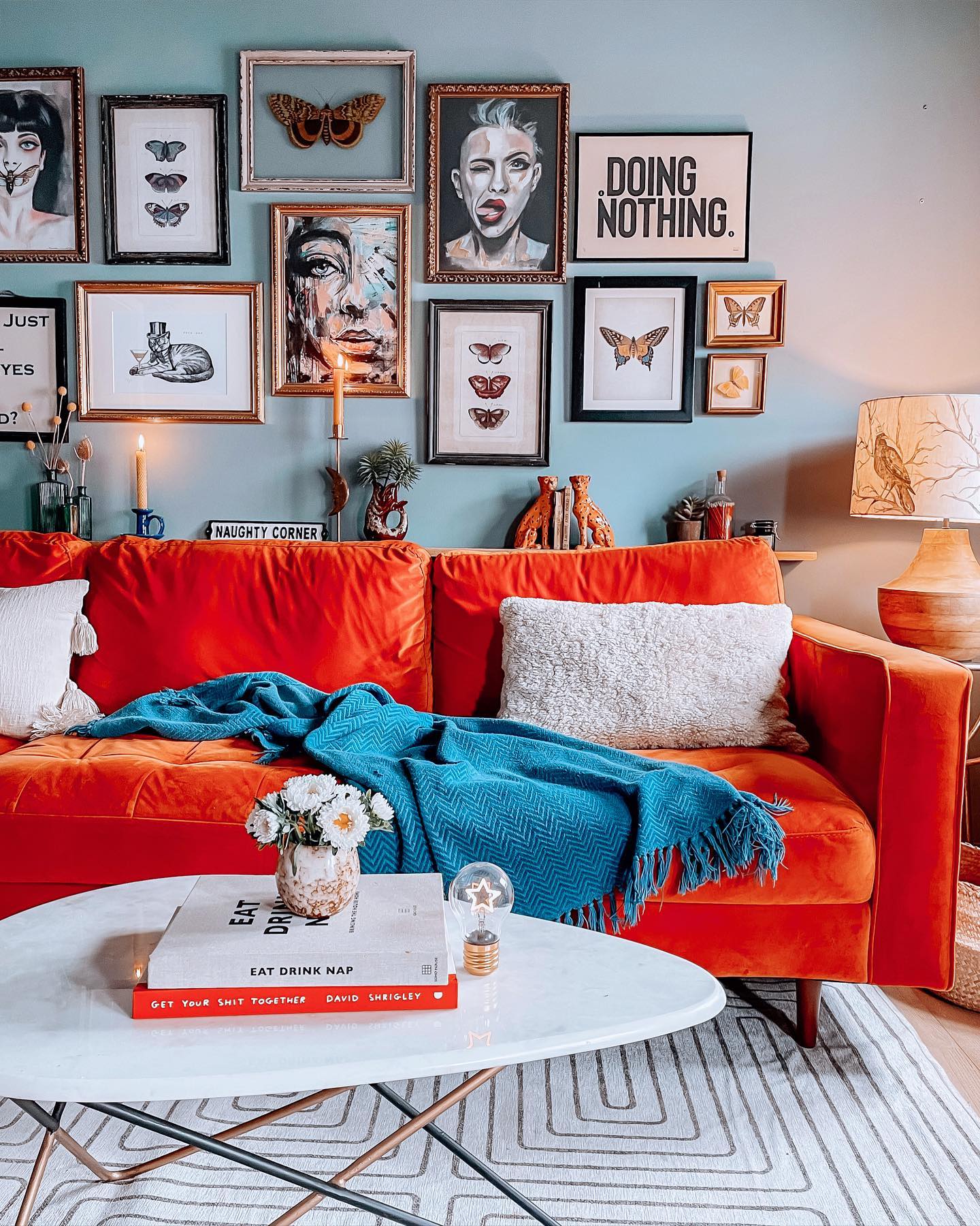 17. Pair an Orange Sofa With Blue Walls