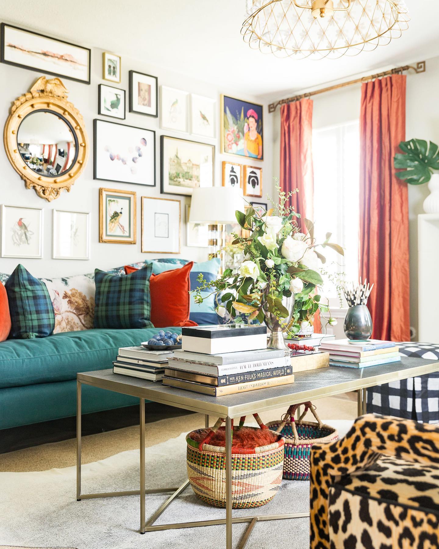 20. Balance a Teal Sofa With Coral Curtains