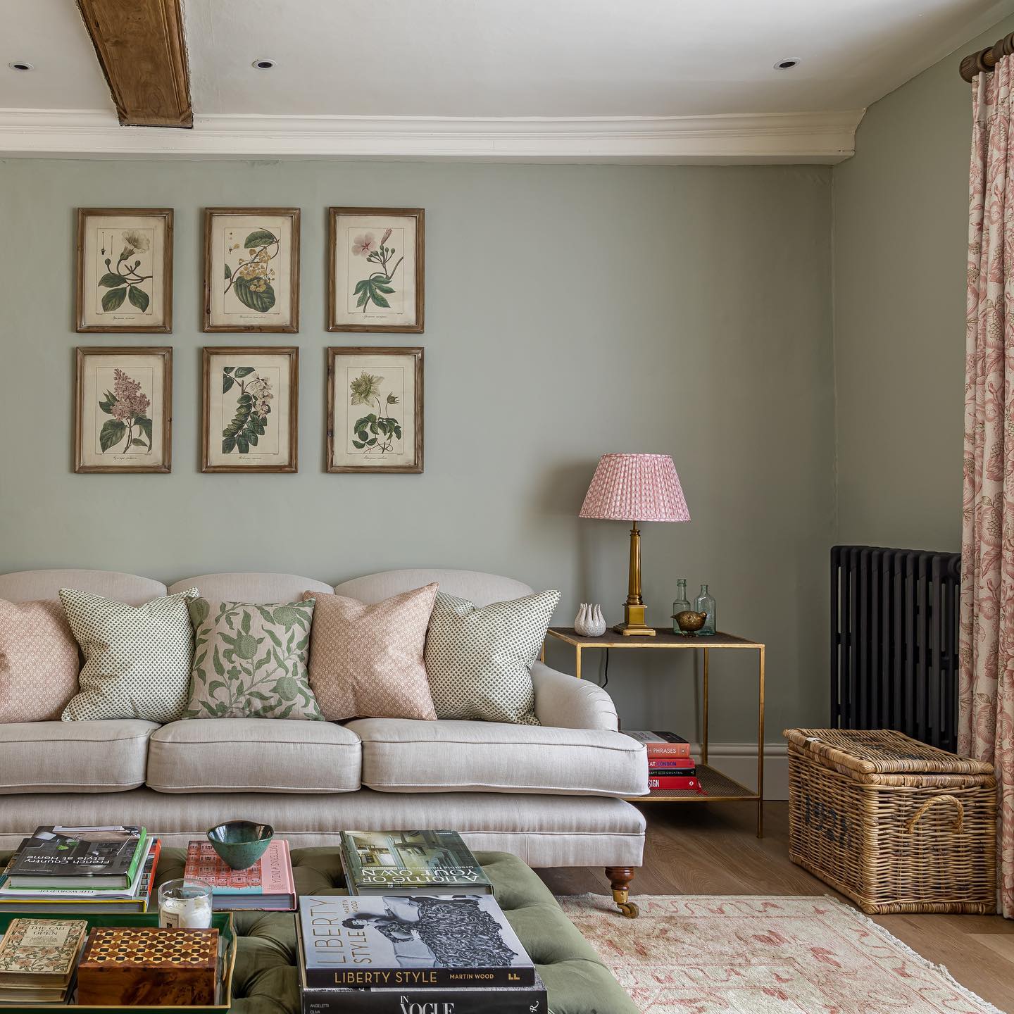 2. Botanical Prints Above a Cream Sofa