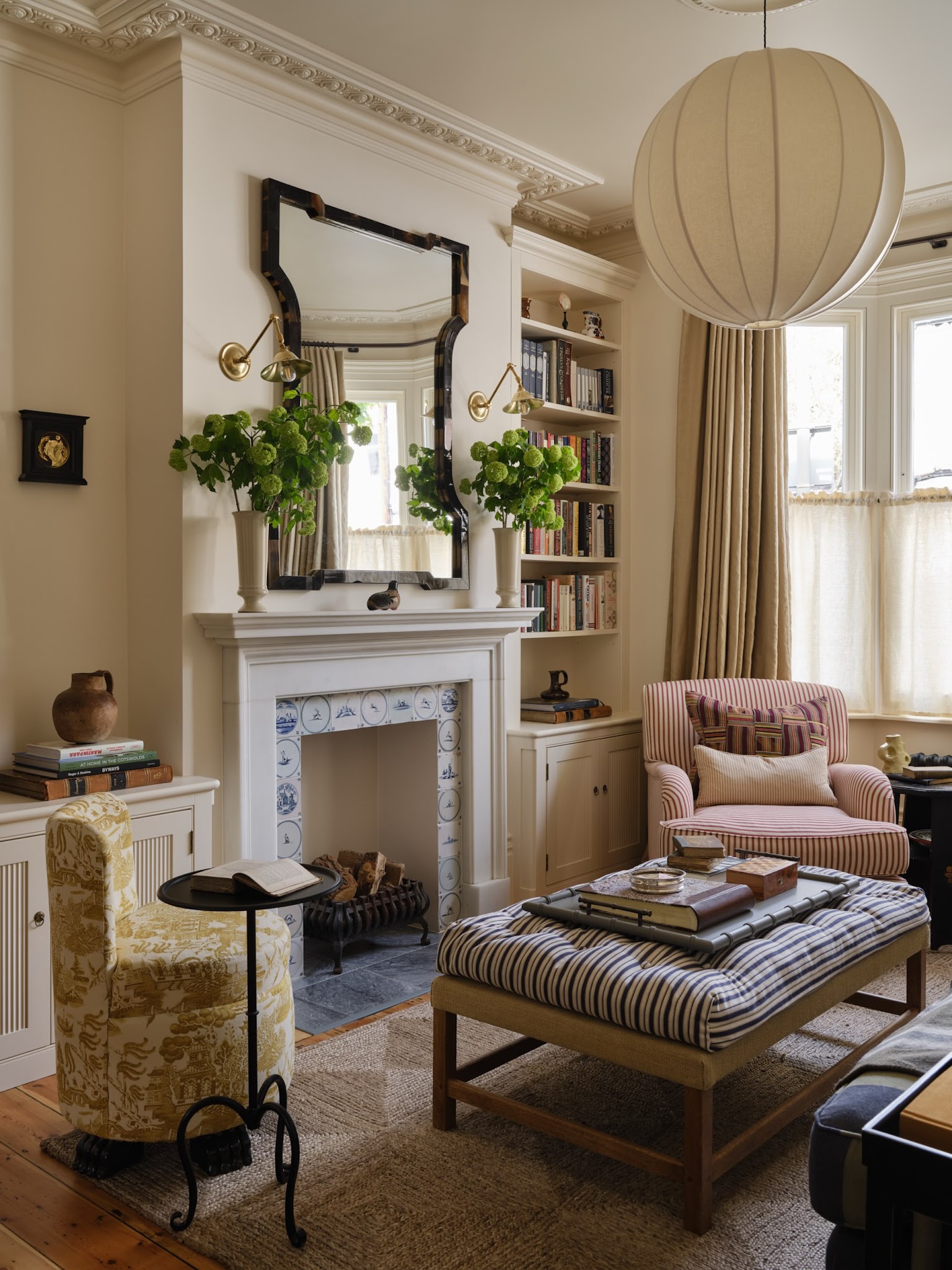 4. A Striped Ottoman by the Fireplace