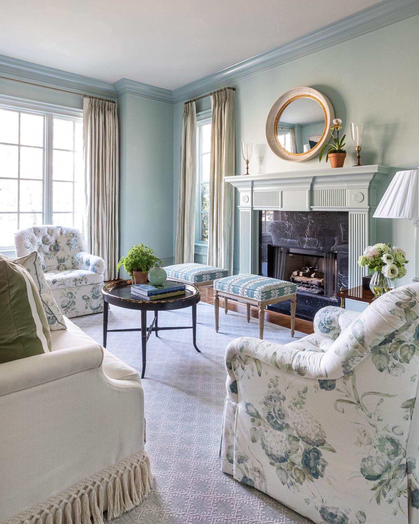 5. Floral Armchairs in a Soft Blue Room