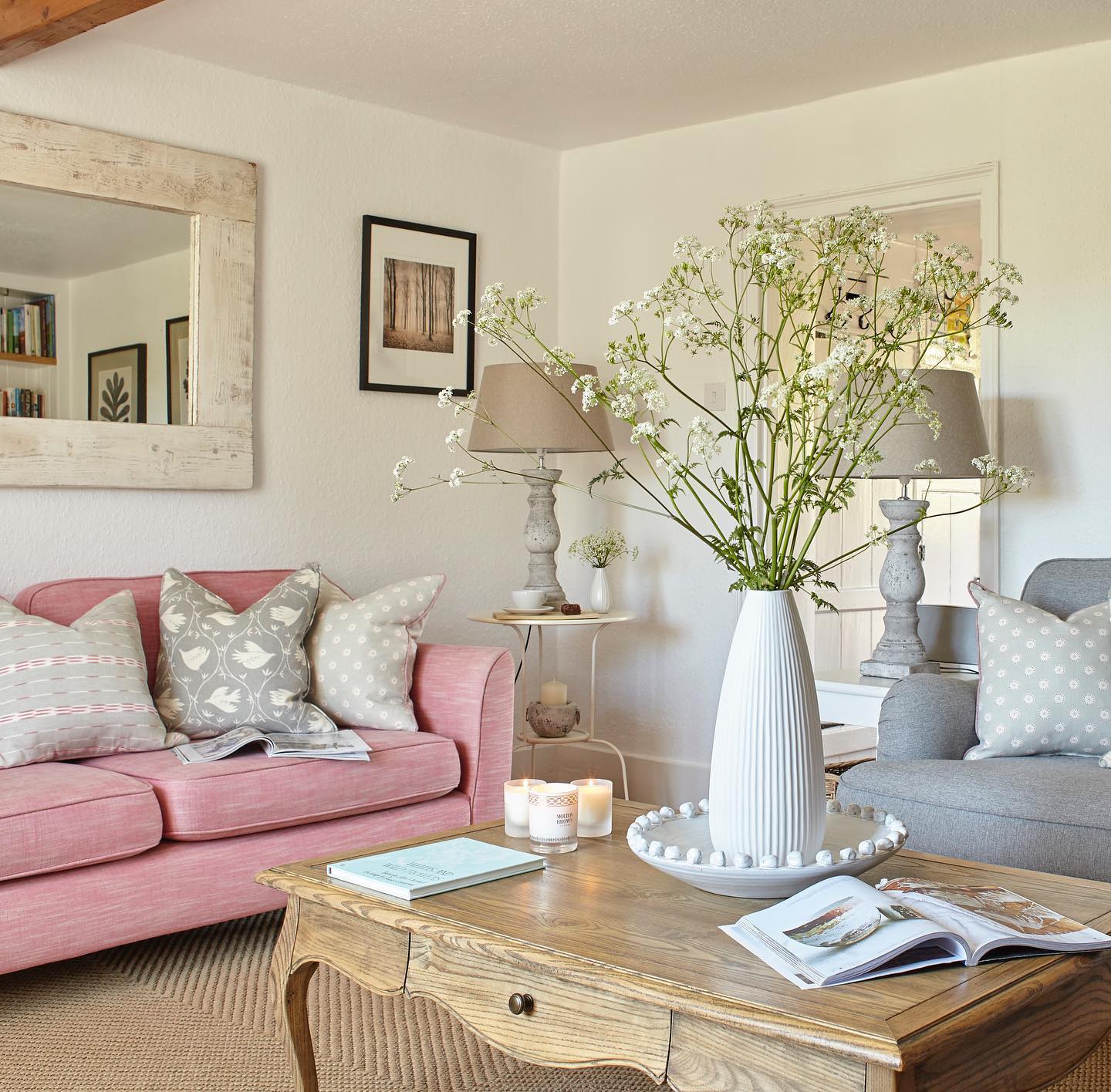 19. A Pink Sofa with Weathered Wood Furniture