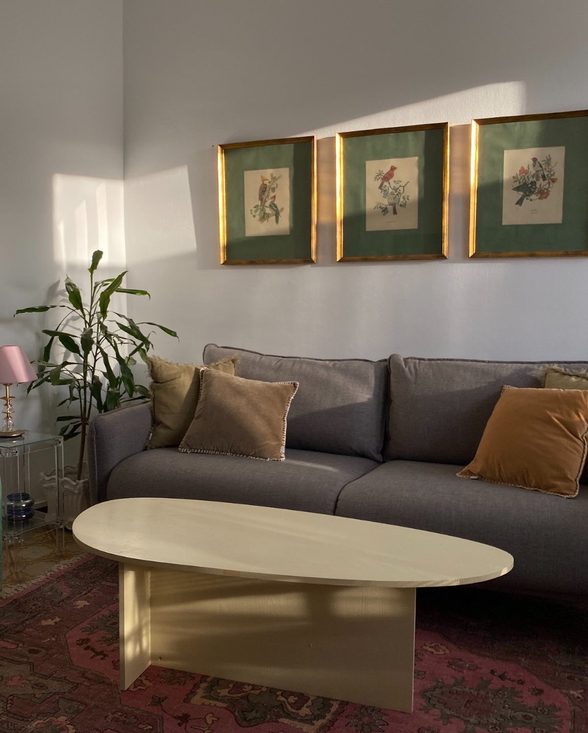 6. Warm a Gray Sofa With a Faded Red Rug