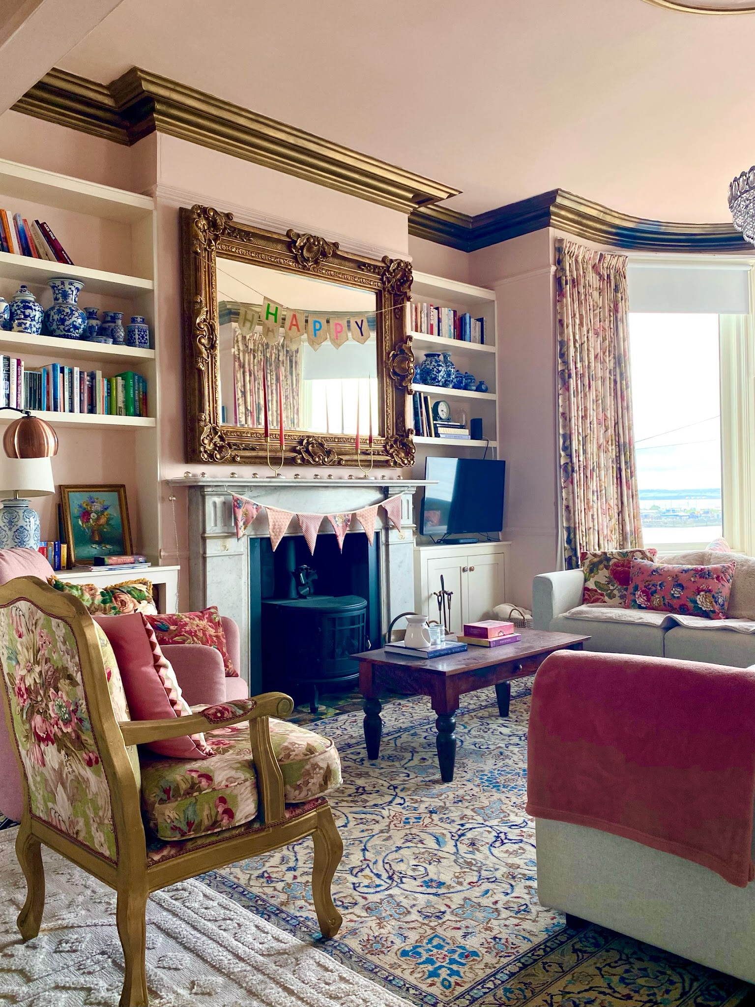 8. Mix Floral Upholstery With Soft Pink Walls