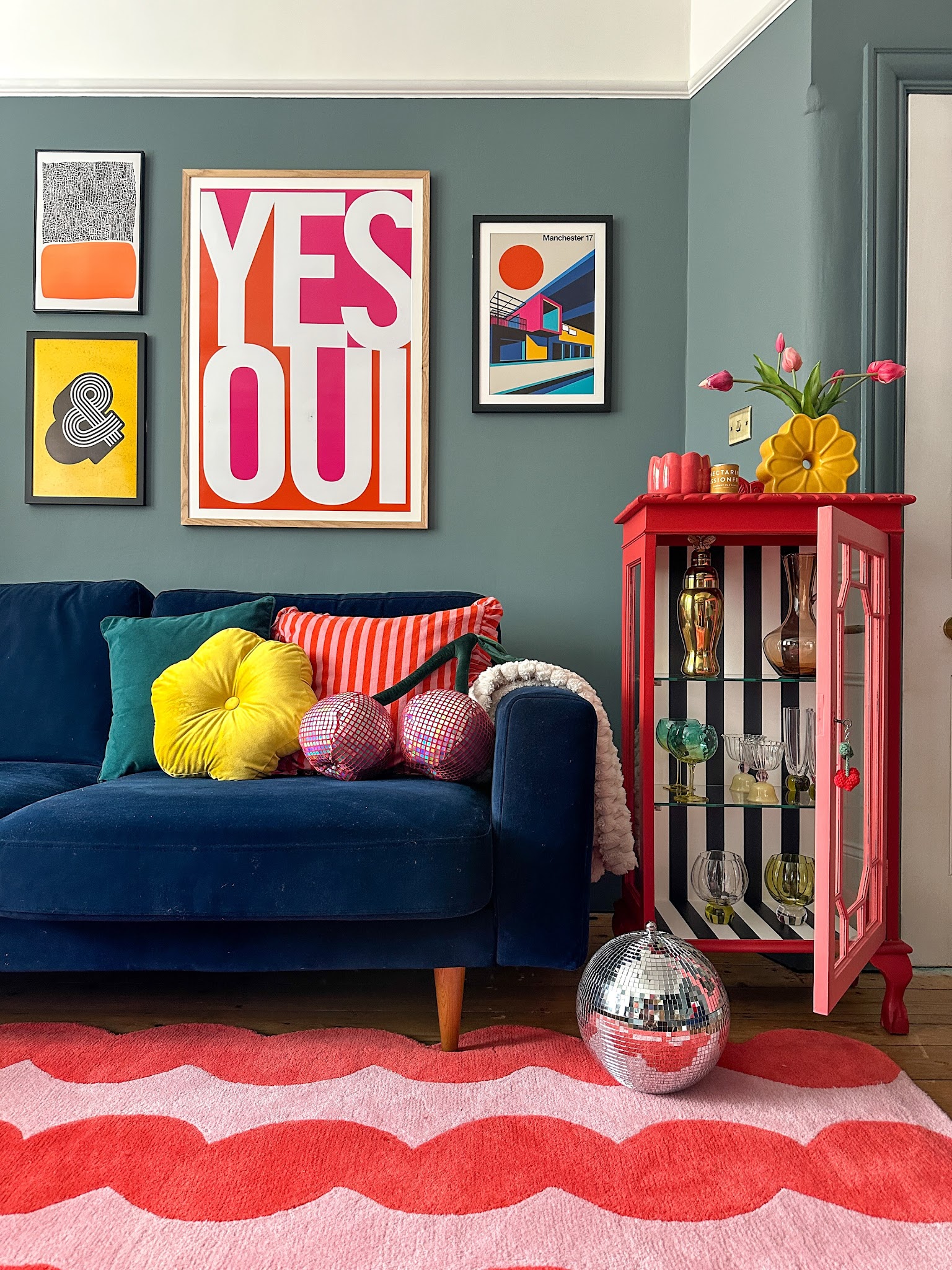 9. Brighten a Navy Sofa With Warm Accent Colors