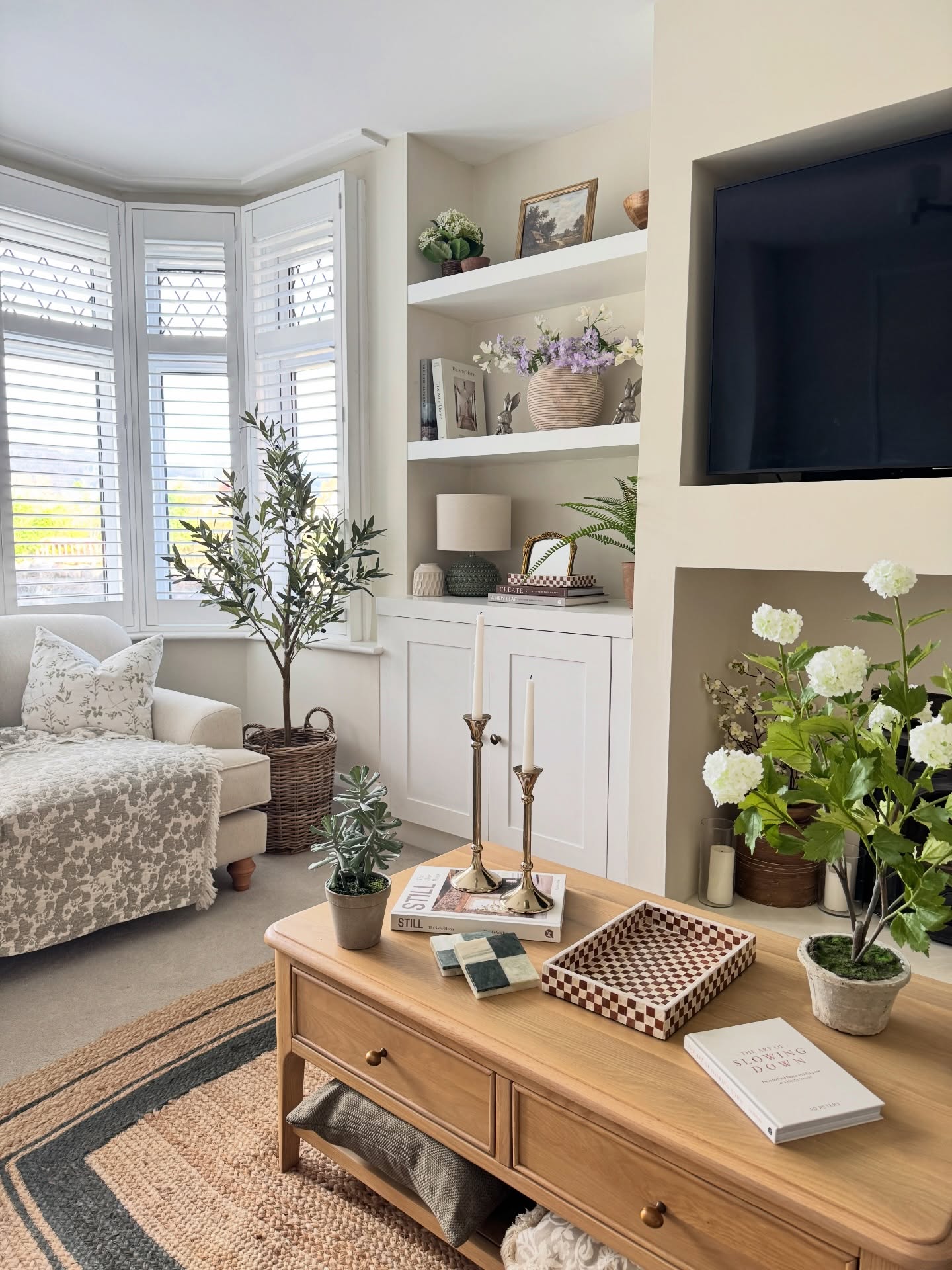6. Warm Built-In Shelves With Beige Backing