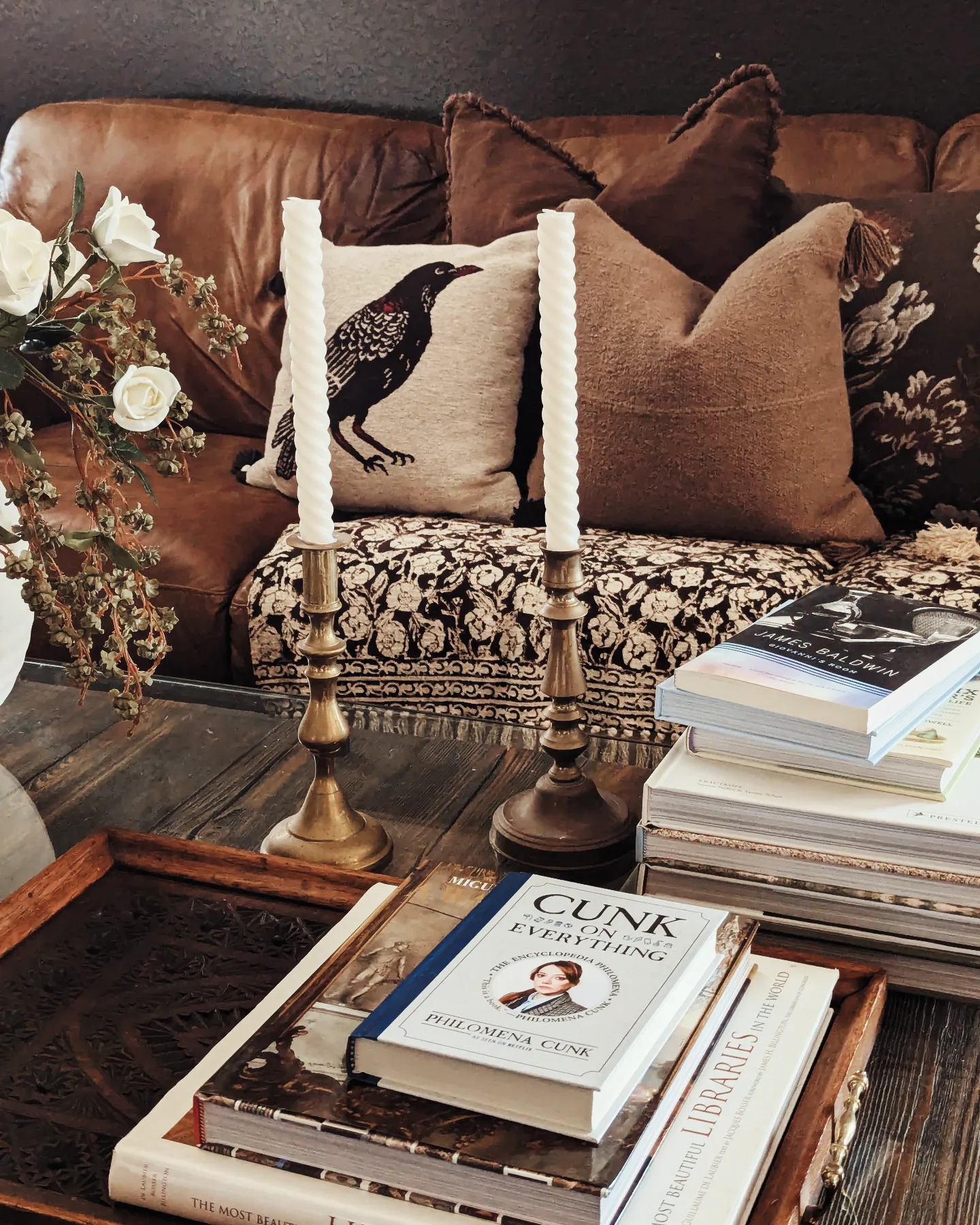 14. Layer a Leather Sofa With Literary Details