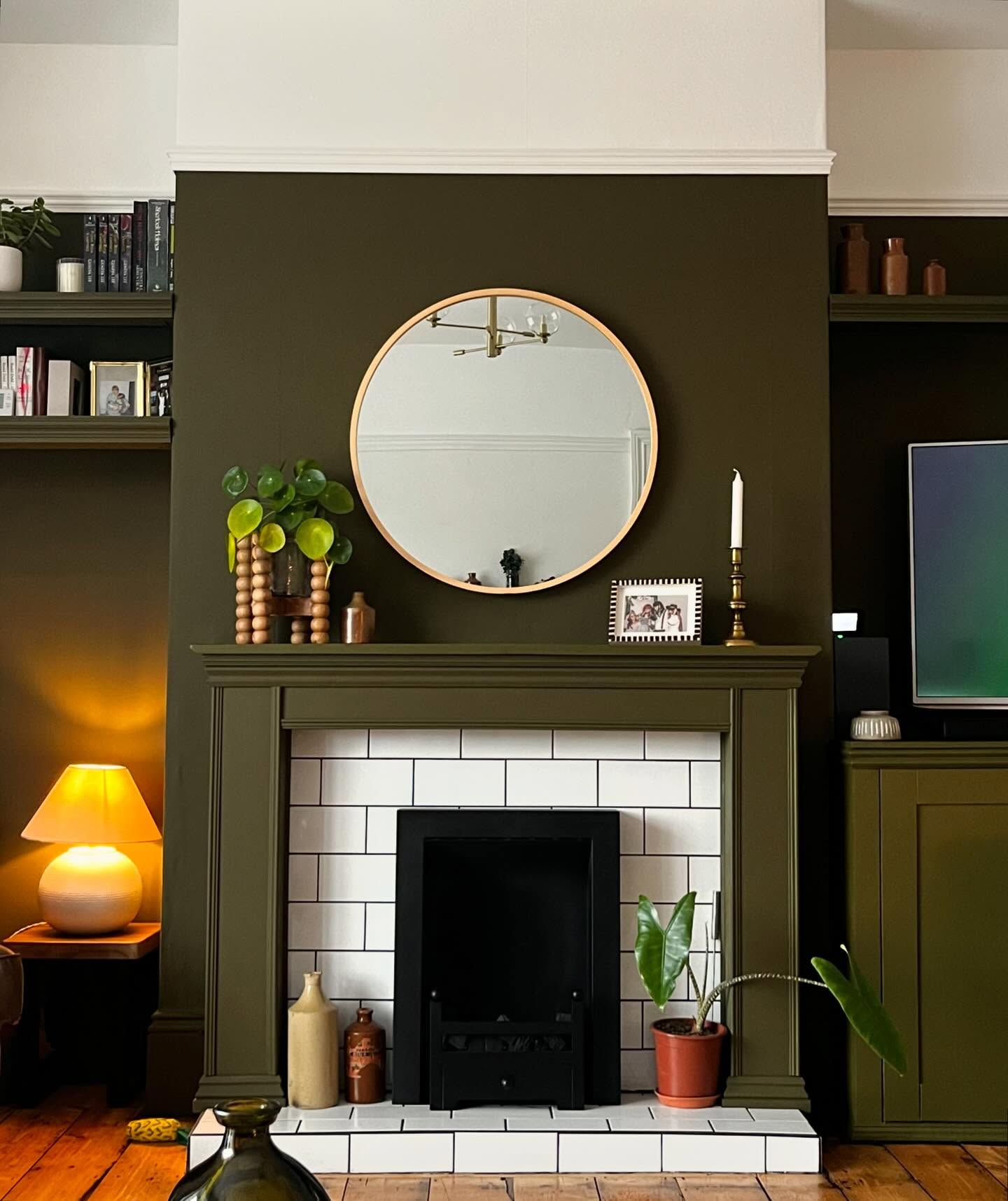 16. Carry Olive Paint Across a Fireplace Wall