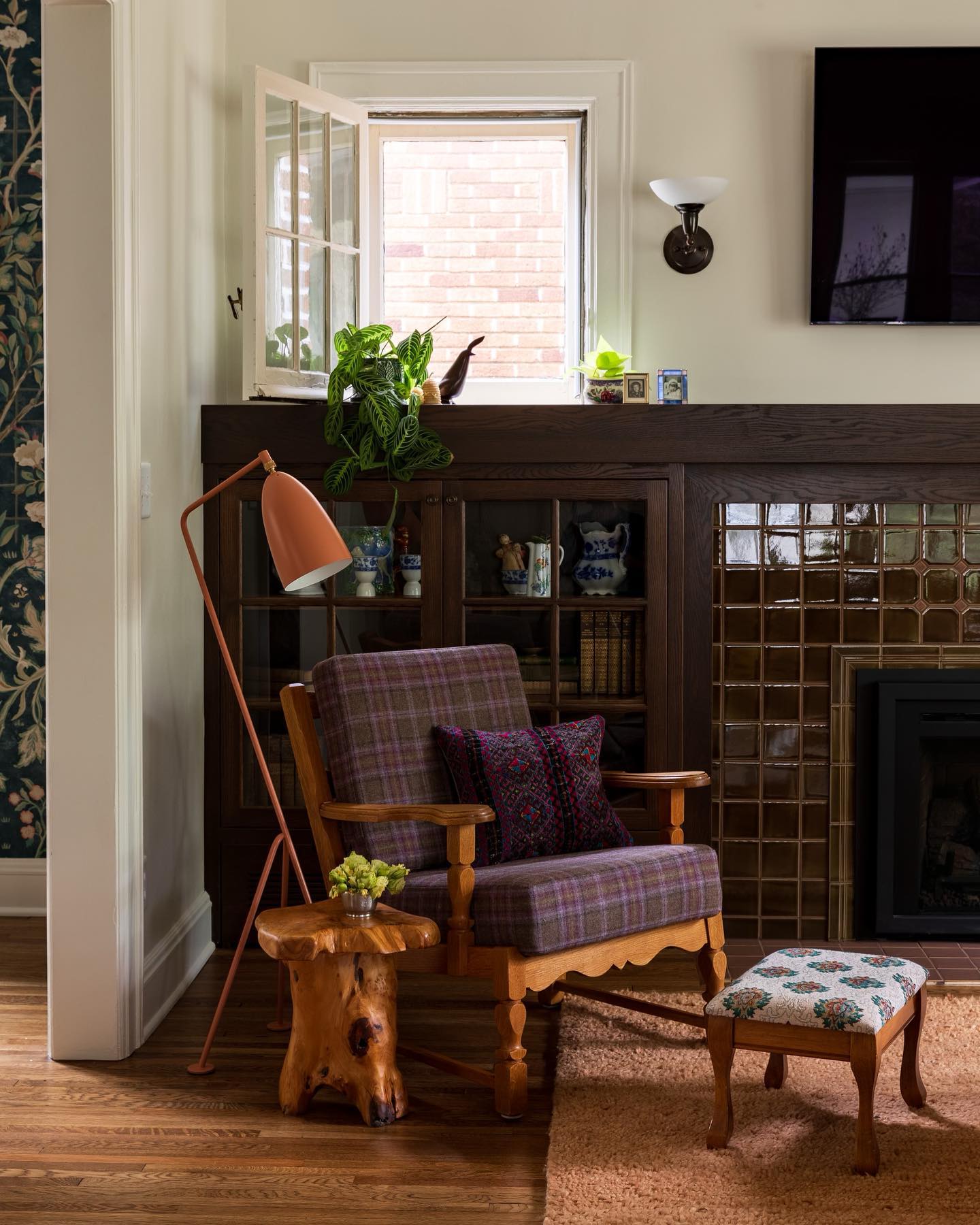 17. Pair Dark Wood and Tile With a Plaid Reading Chair