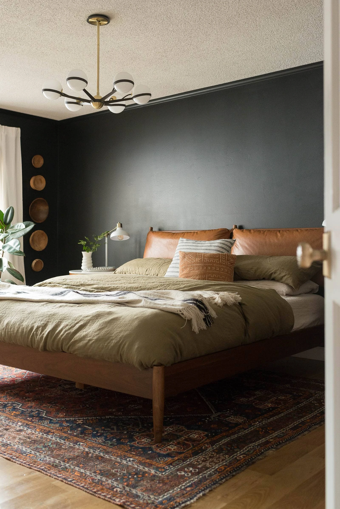 4. Layer Olive Linen and Cognac Leather Over a Vintage Rug