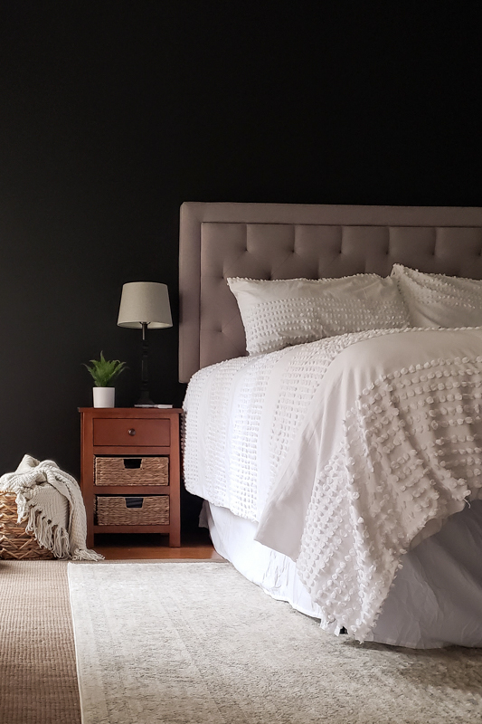 14. Use Raised White Bedding to Balance Near Black Walls