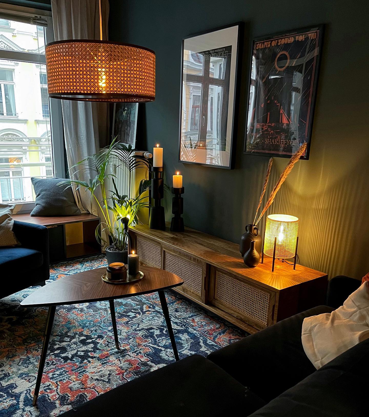 2. Warm Deep Teal Walls With Woven Lighting