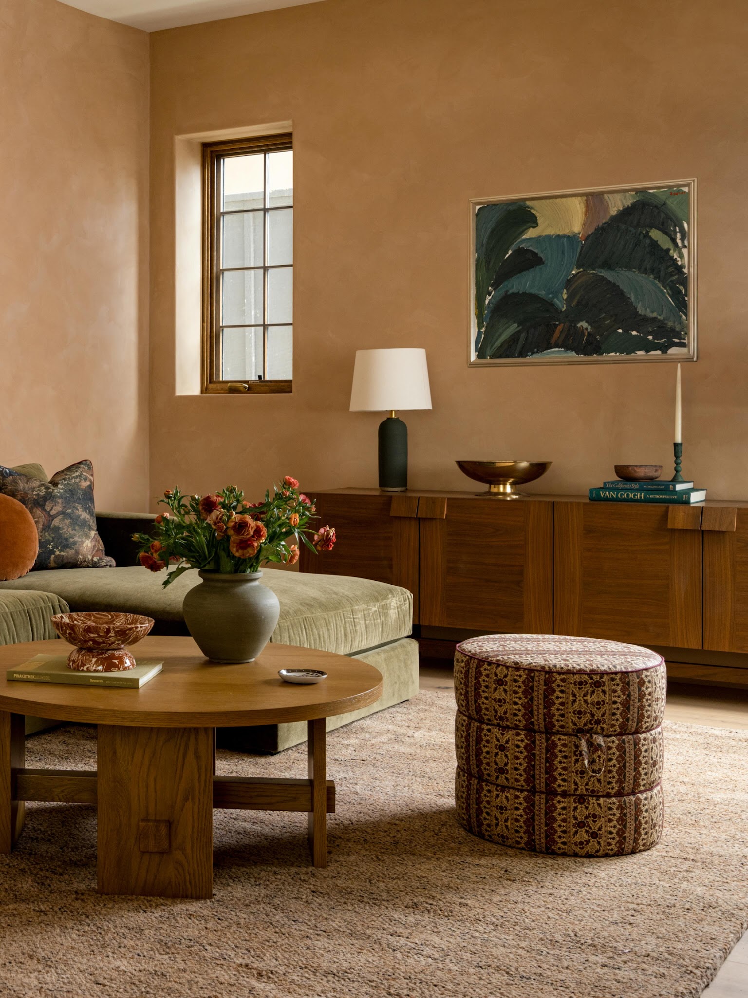 6. Deepen Warm Walls With Dark Green Art
