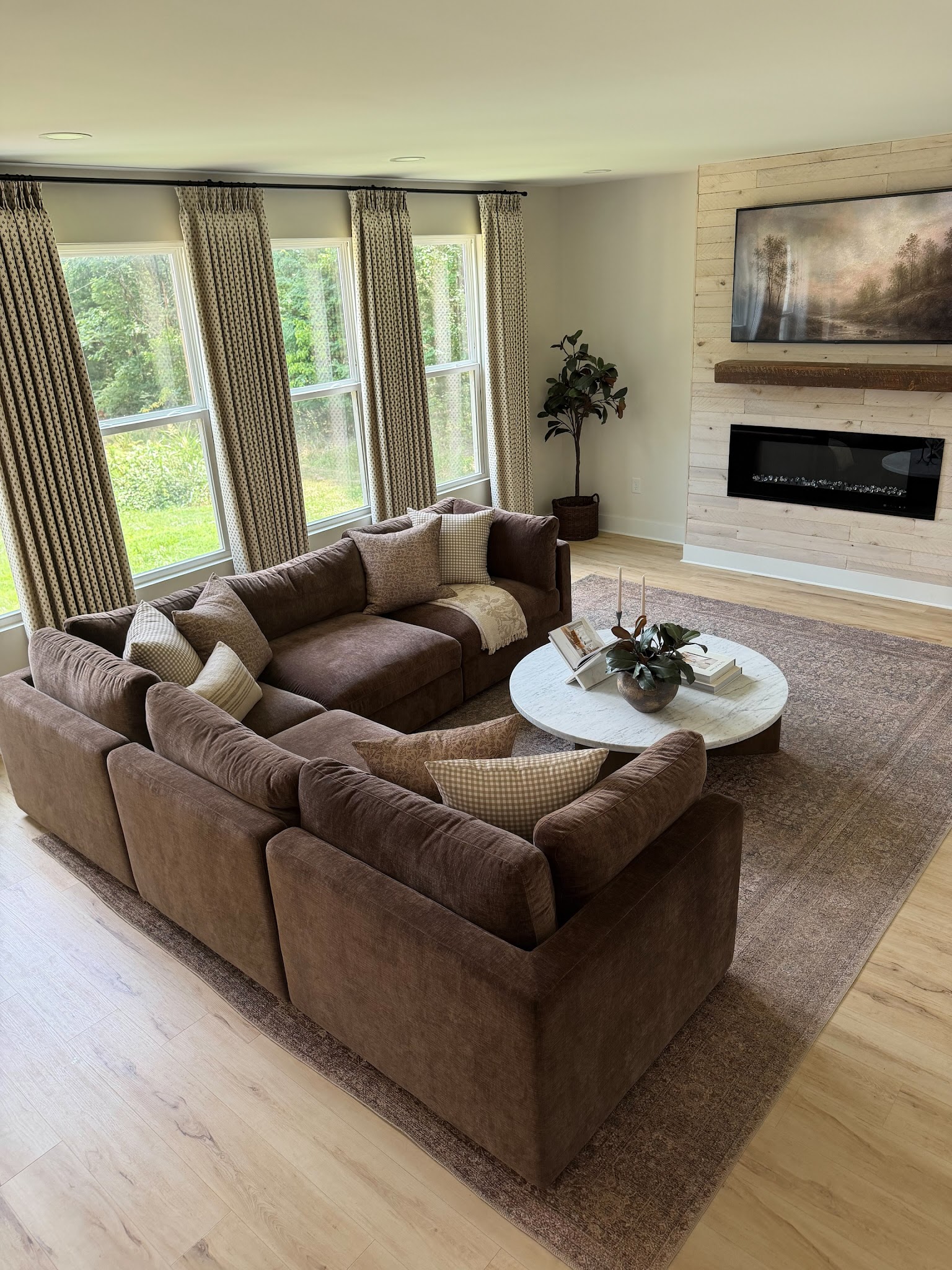 2. Balance a Brown Sectional With a Pale Round Table