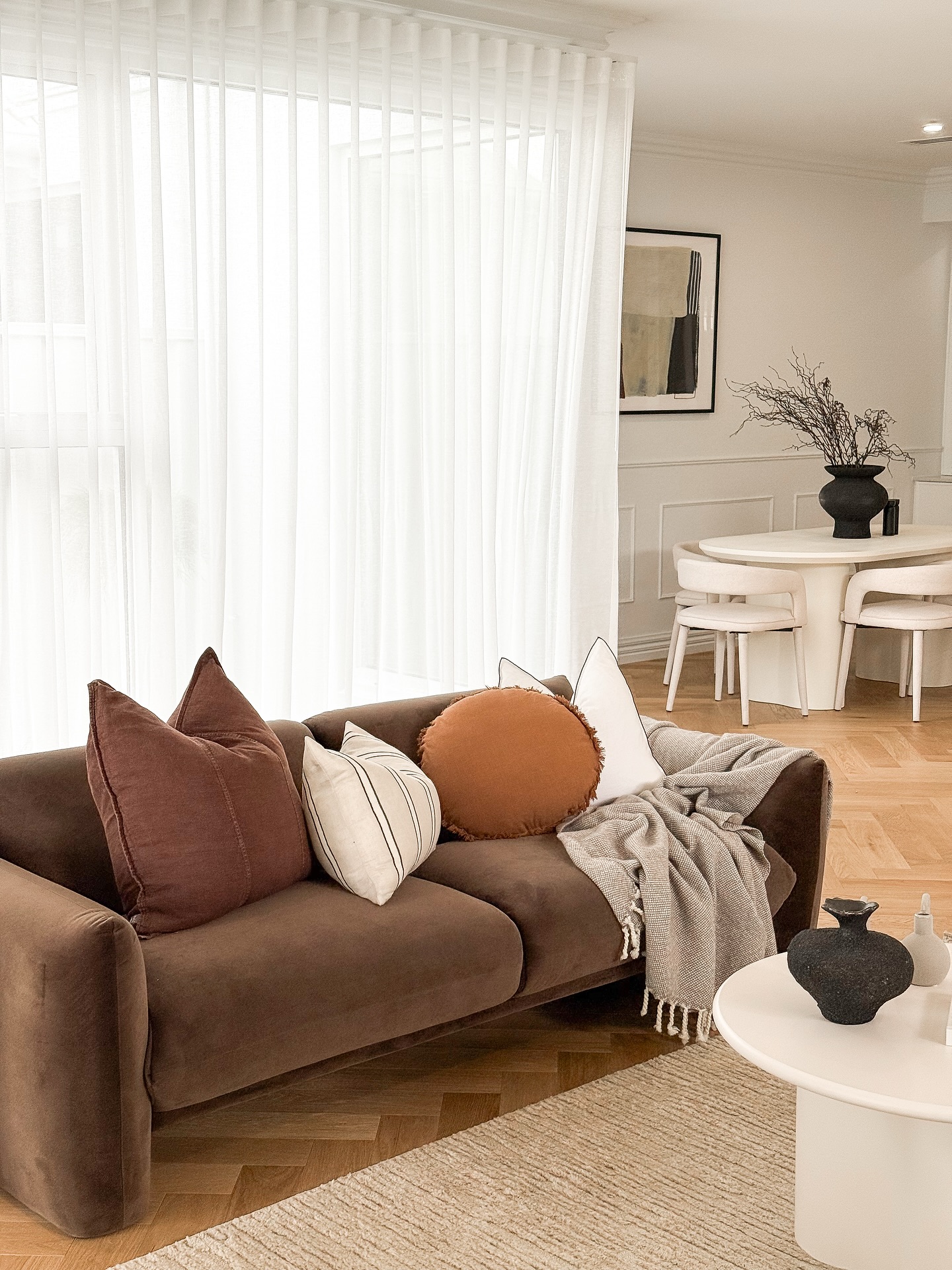 5. Brighten Brown Upholstery With White Curtains
