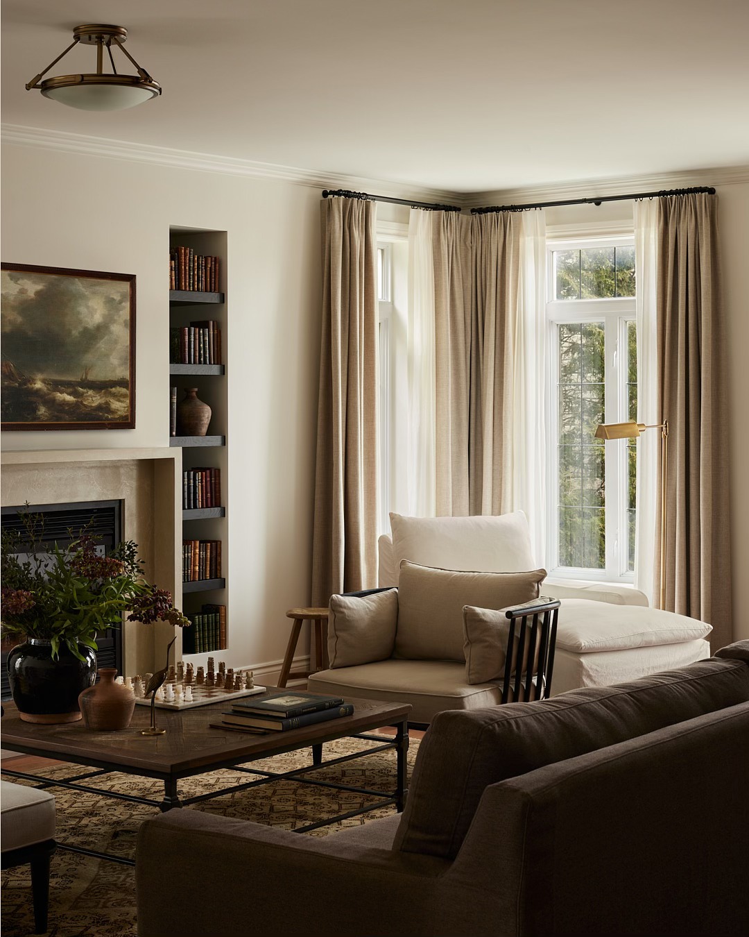 8. Use a Dark Sofa to Frame a Light Conversation Area