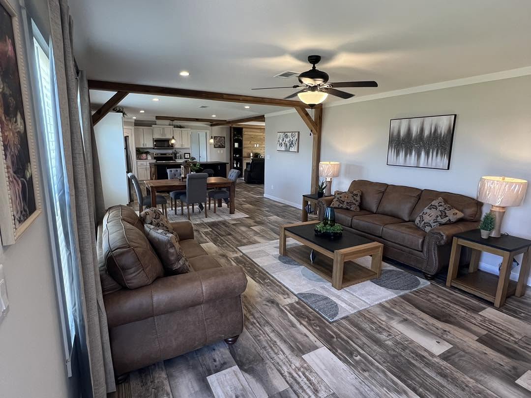 16. Arrange Matching Brown Sofas Around a Centered Rug