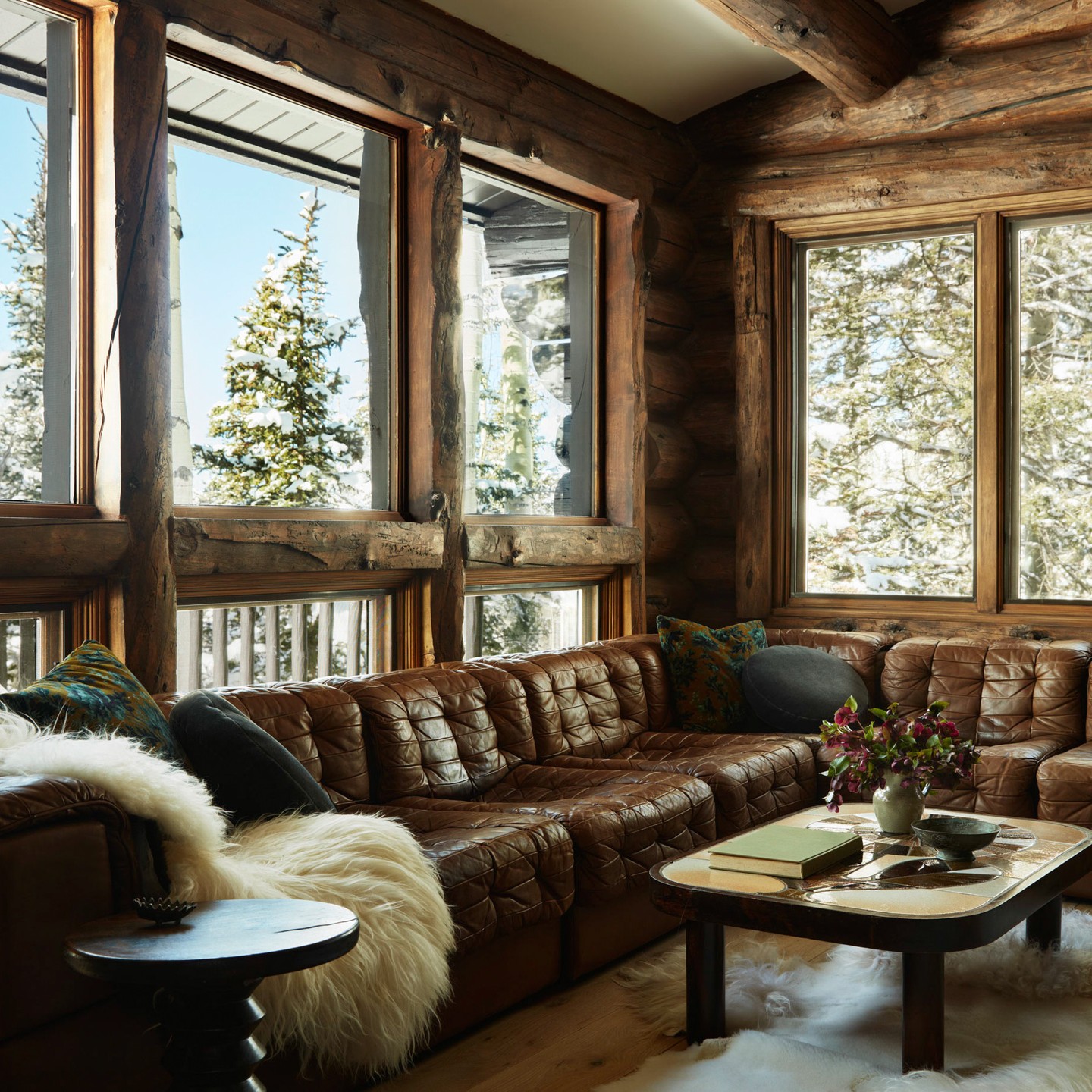 19. Soften a Brown Leather Sectional With White Throws