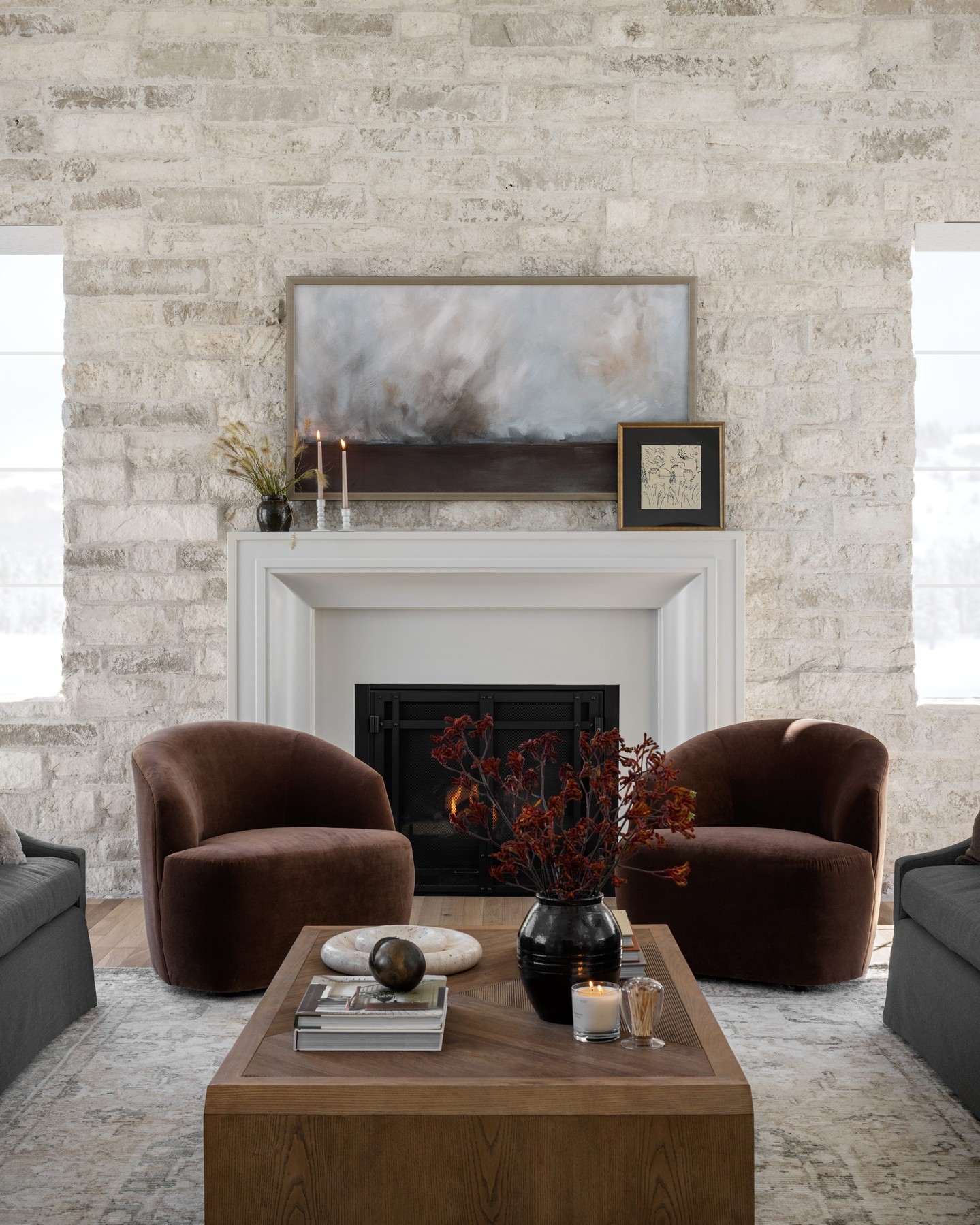12. Gather Cocoa Chairs Around a Pale Fireplace