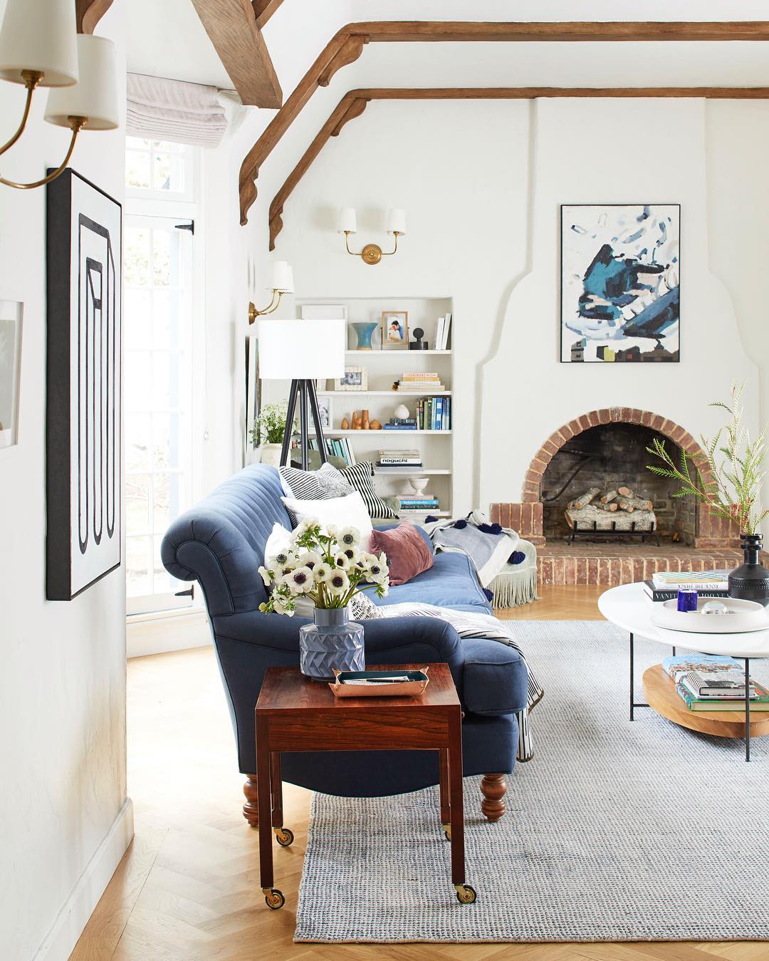 2. Balance Rustic Beams With a Light Coffee Table