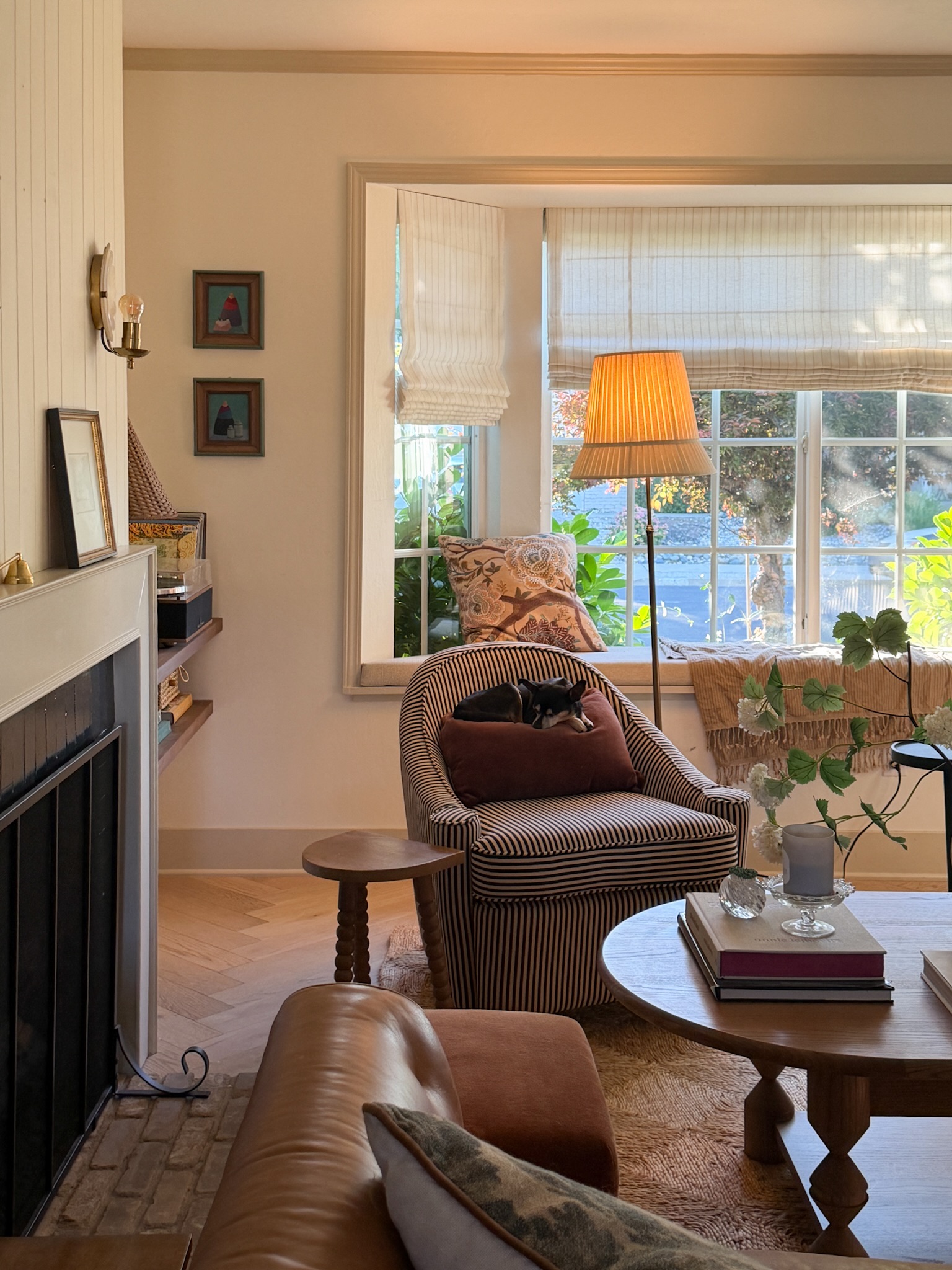 7. Pair a Striped Skirted Chair With a Leather Sofa