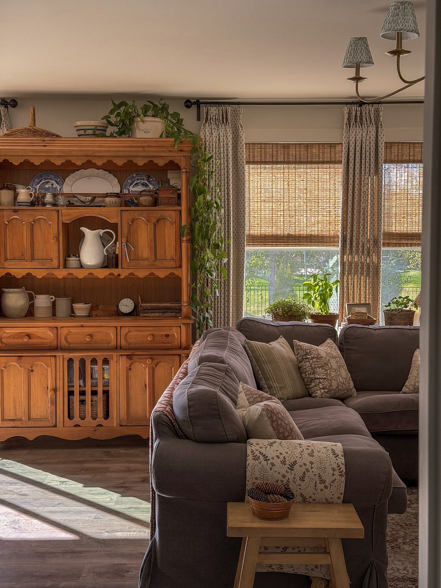 12. Layer Small Floral Curtains Over Woven Shades