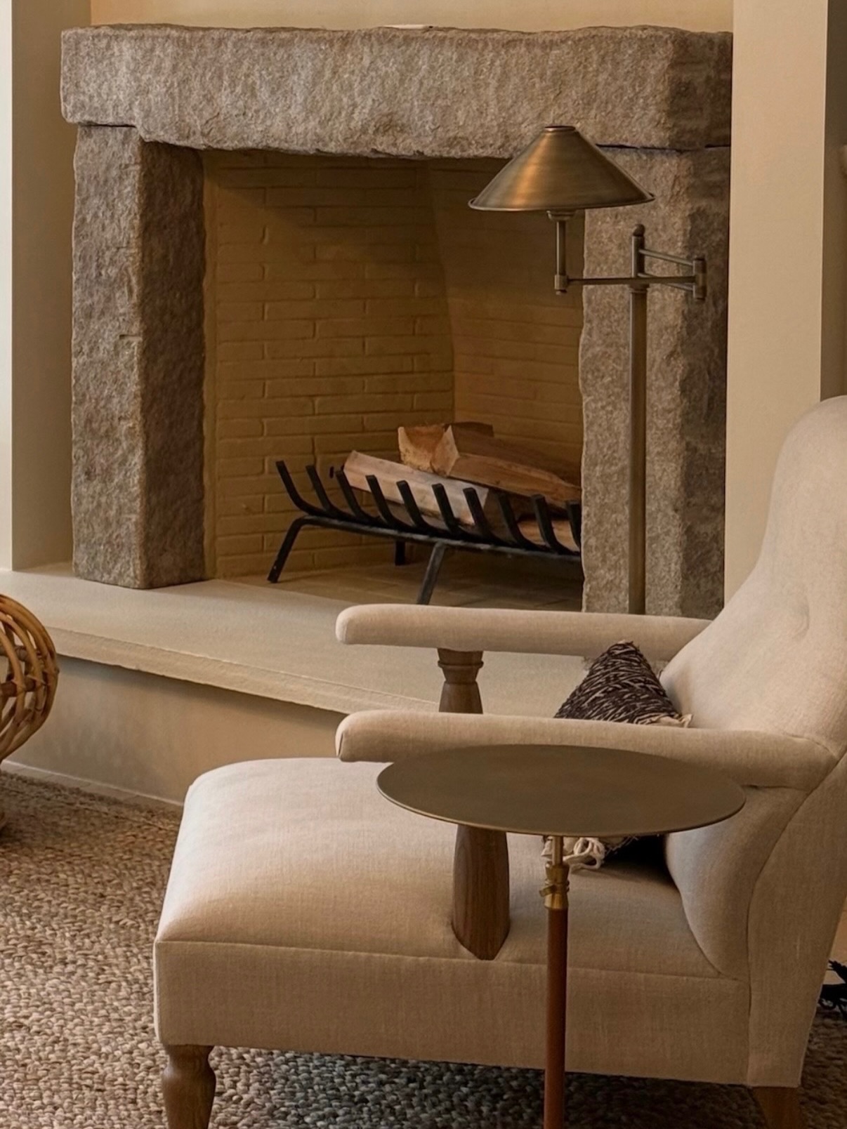 17. Soften a Rough Stone Hearth With an Upholstered Chair