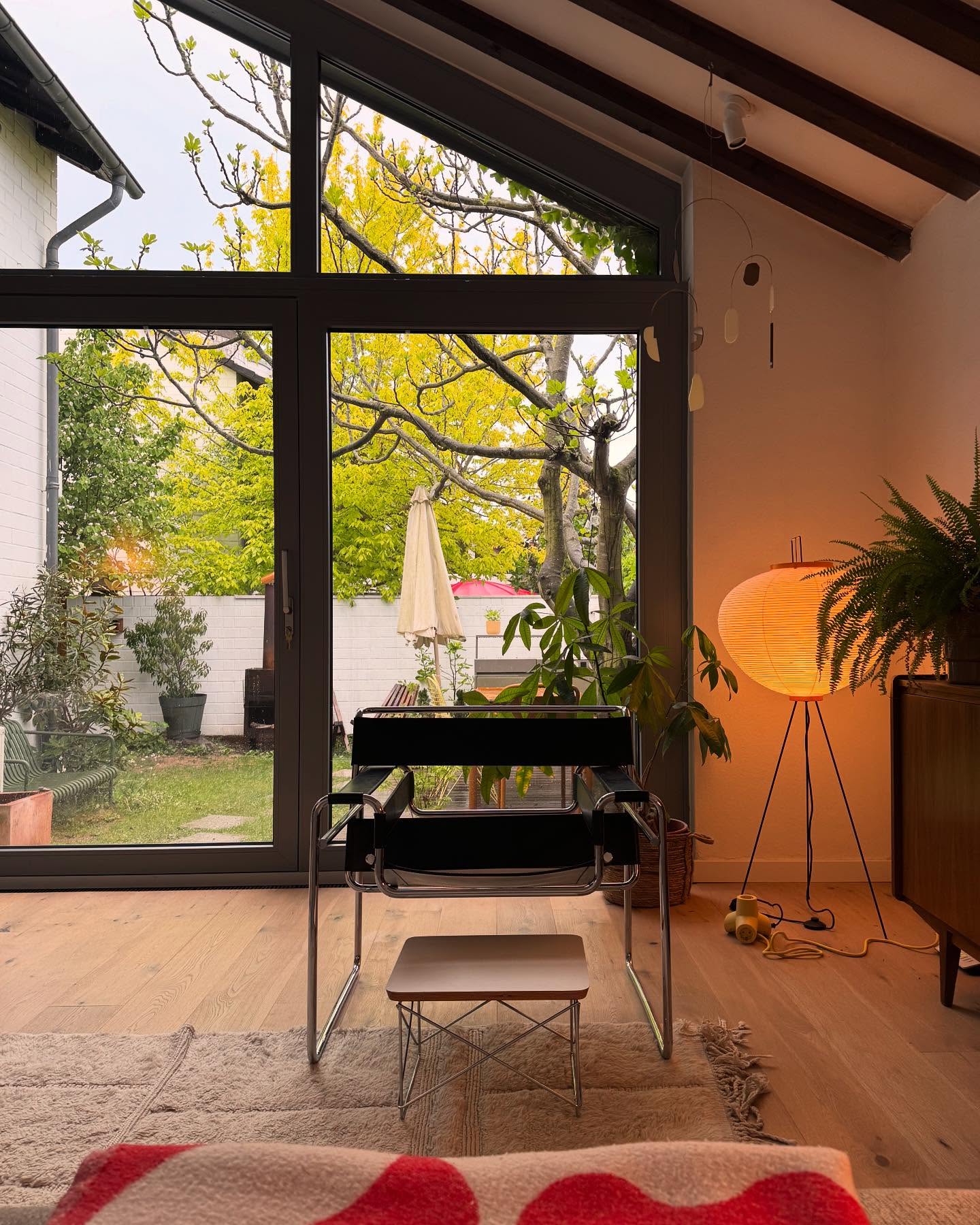 12. Warm a Glass Corner with a Paper Lantern