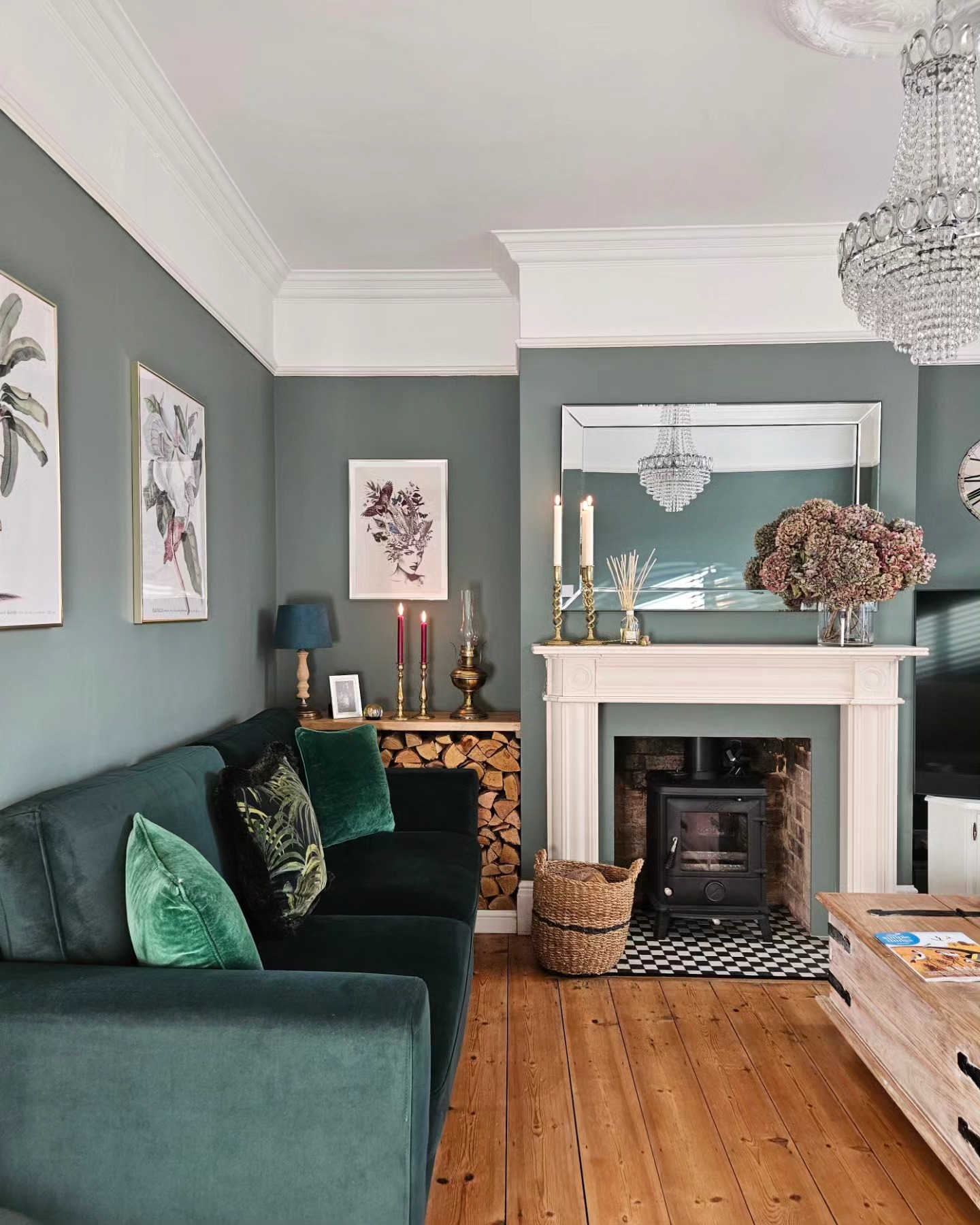 9. Highlight a White Fireplace With Deep Green Seating