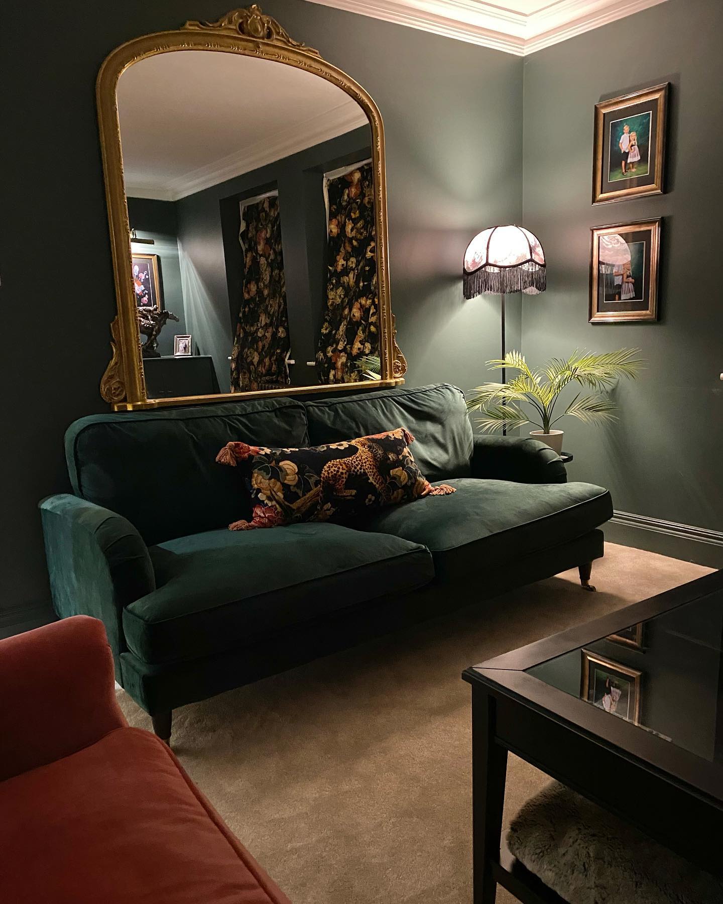 18. Hang an Oversized Mirror Above Green Seating