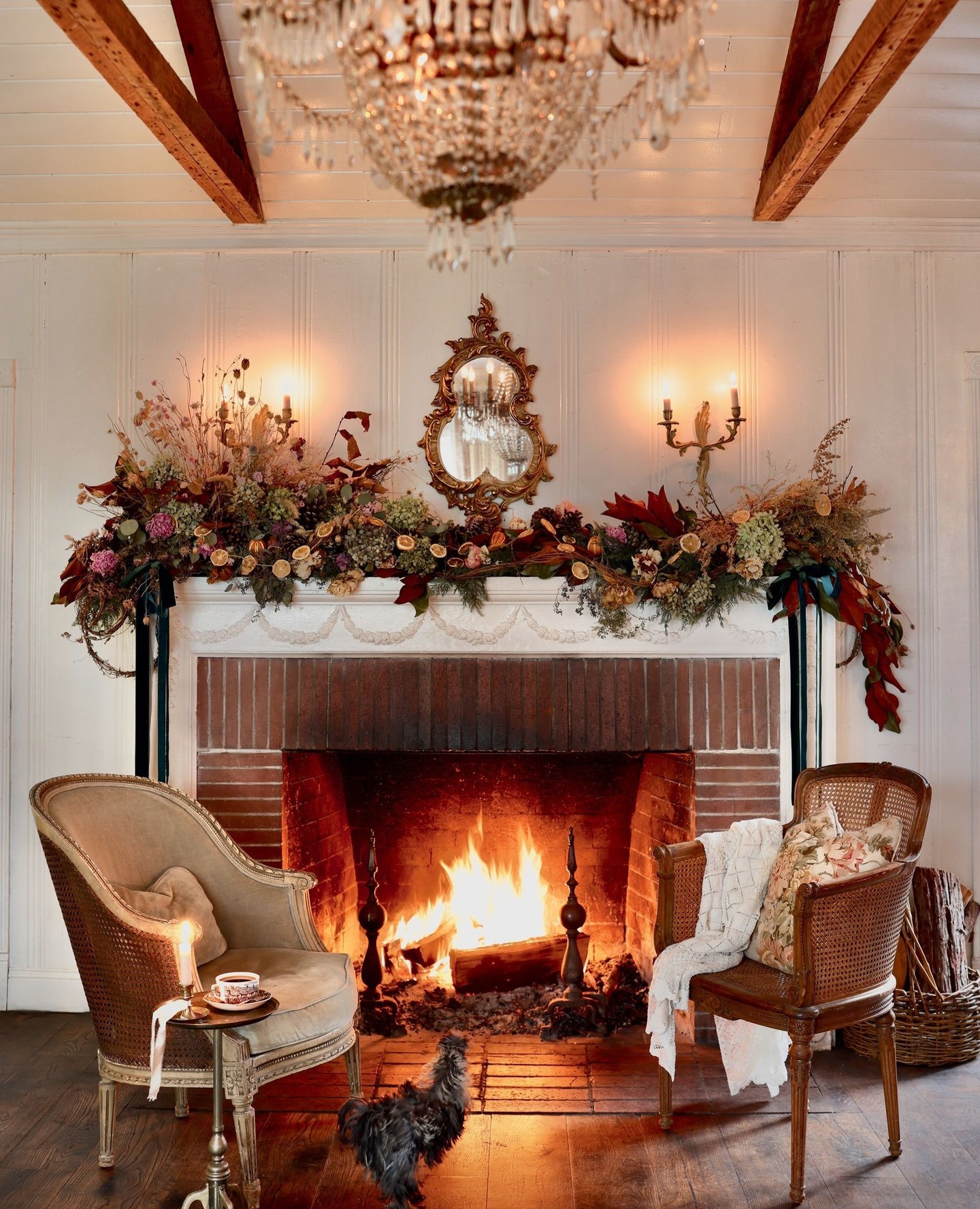 3. Pair Curved Chairs Around a Decorated Hearth