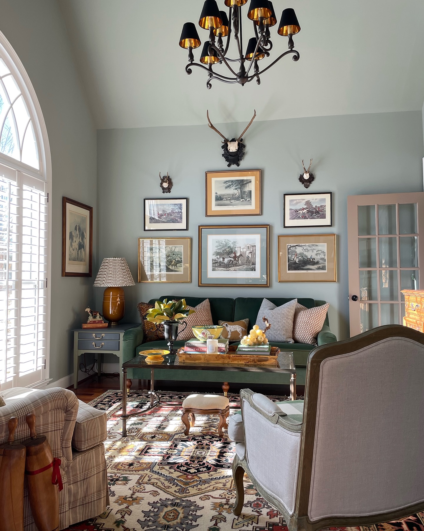 4. Give a Green Sofa a Collected Backdrop