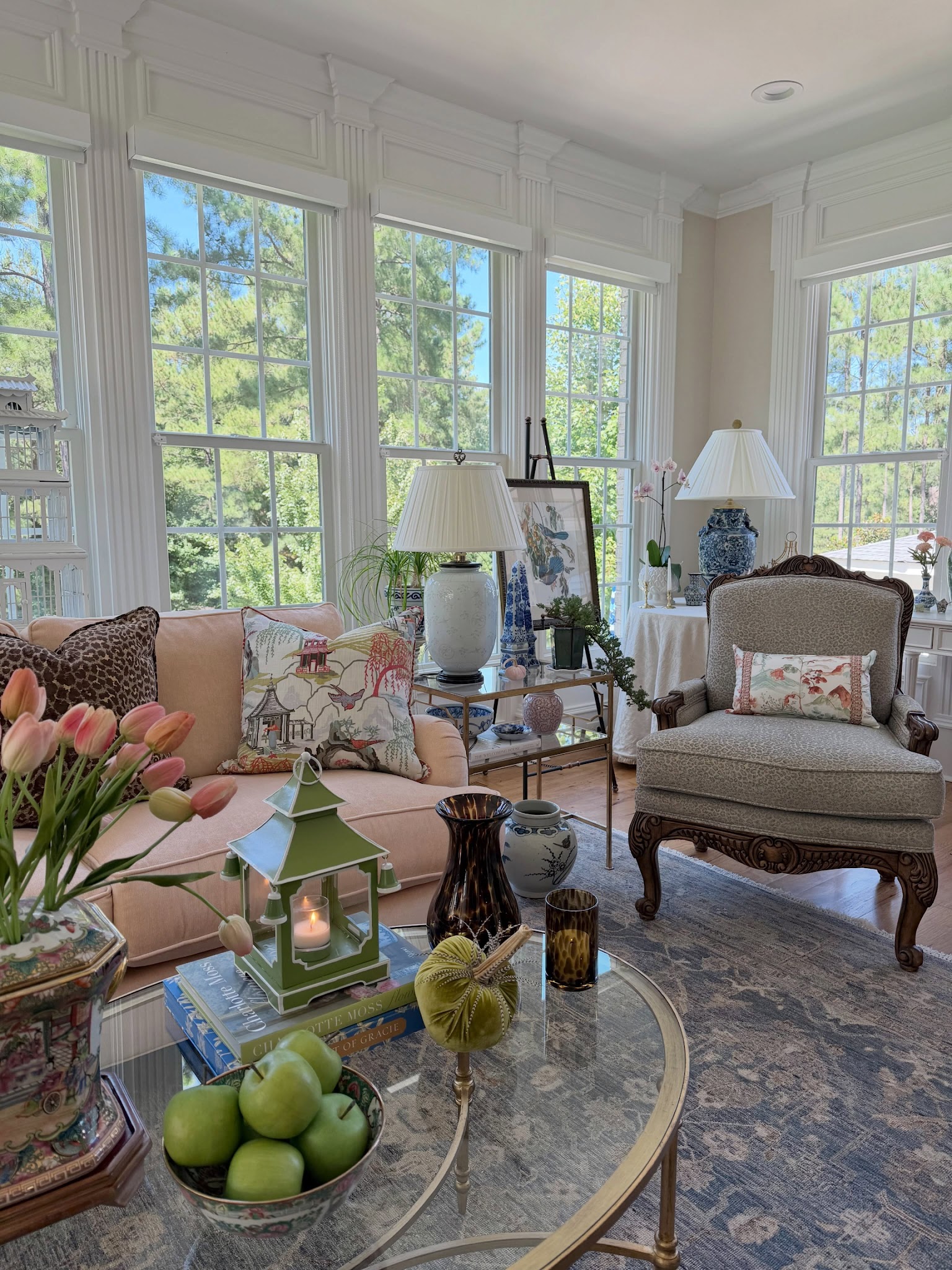 9. Mix a Carved Armchair With Soft Pink Seating