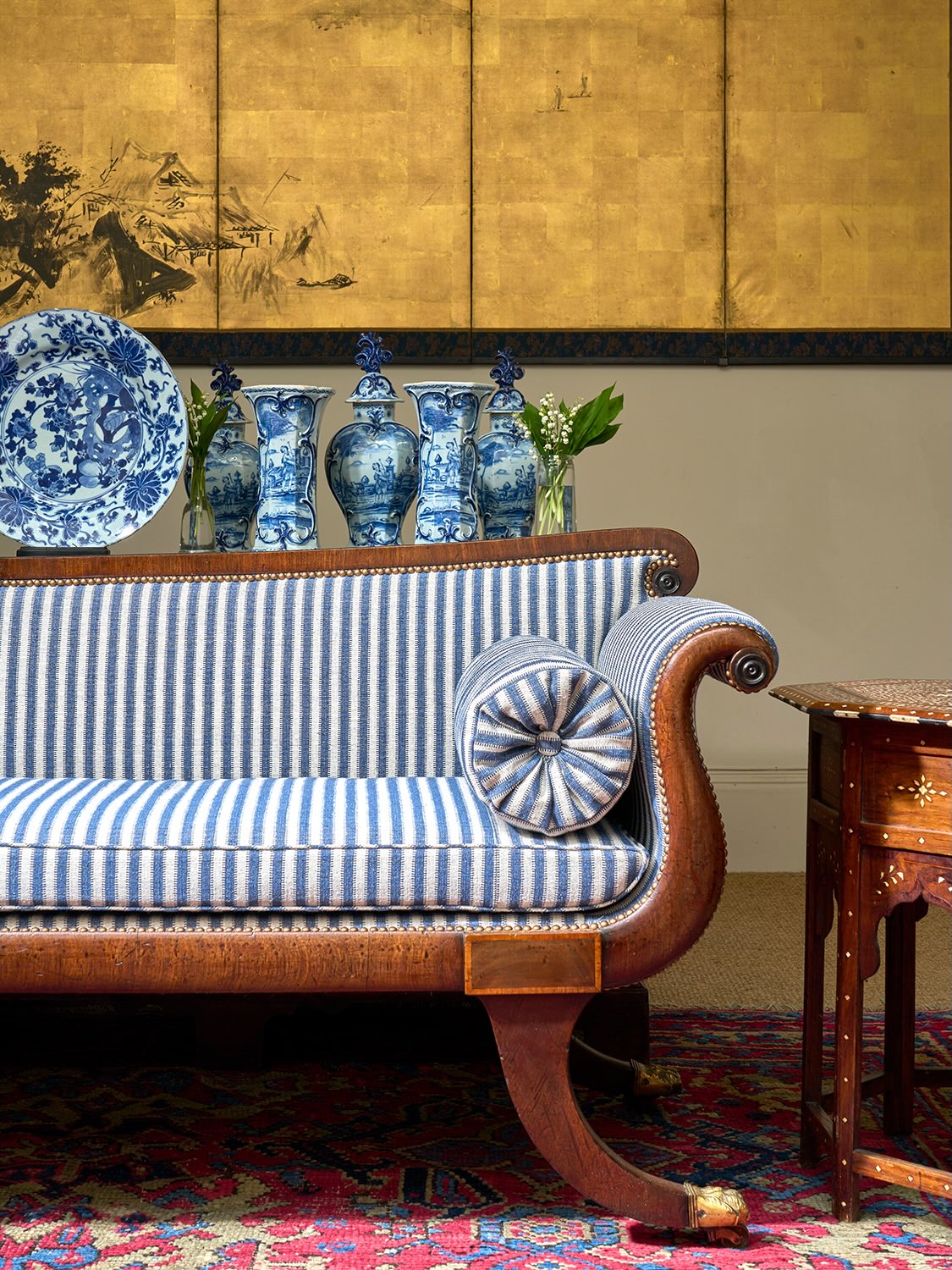 13. Refresh a Curved Settee With Blue Stripes