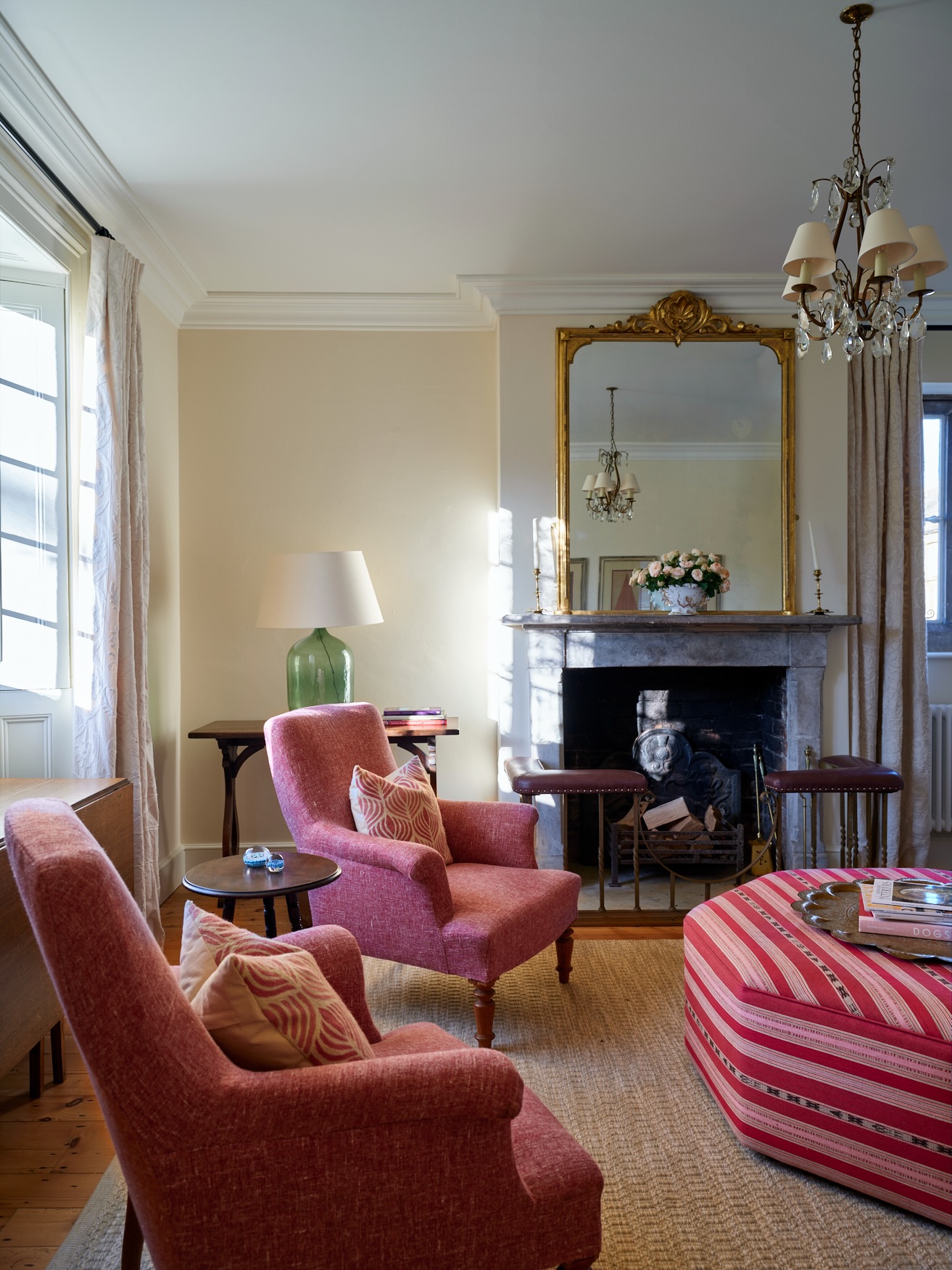 15. Bring Coral Seating Into a Quiet Fireplace Scheme