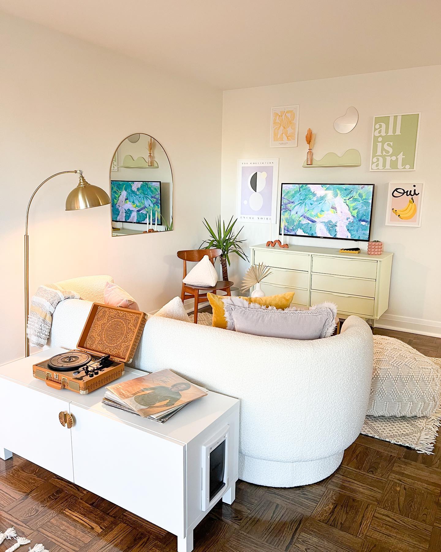 2. Rounded Seating and a Pastel Gallery Wall