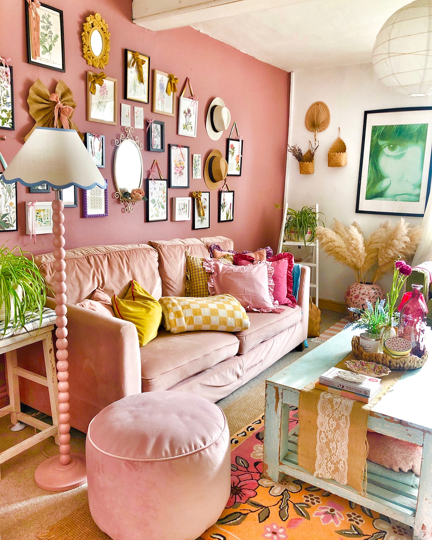3. A Pink Sofa Beneath a Collected Gallery