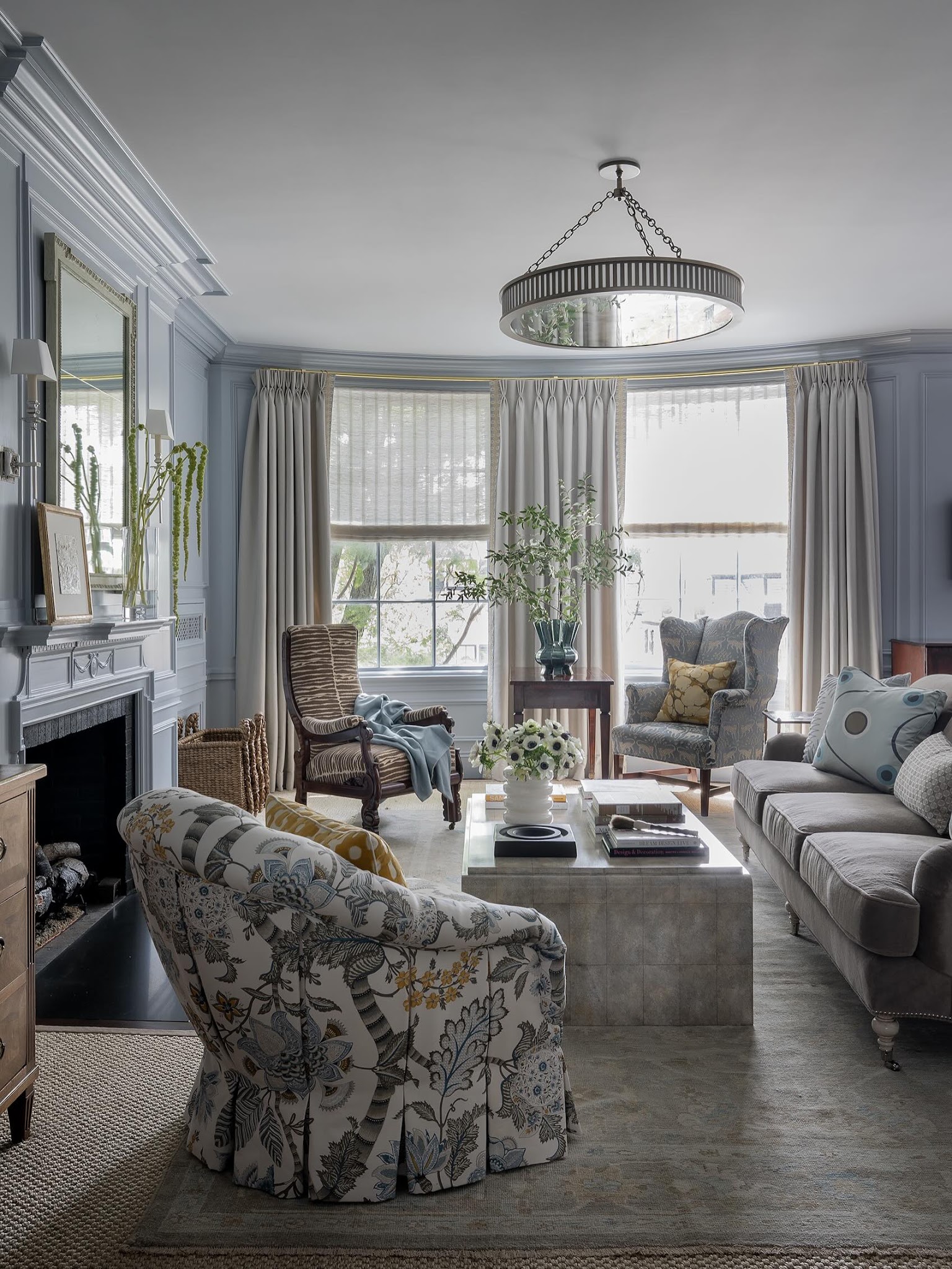 12. Mix Floral Chairs With Powder Blue Walls