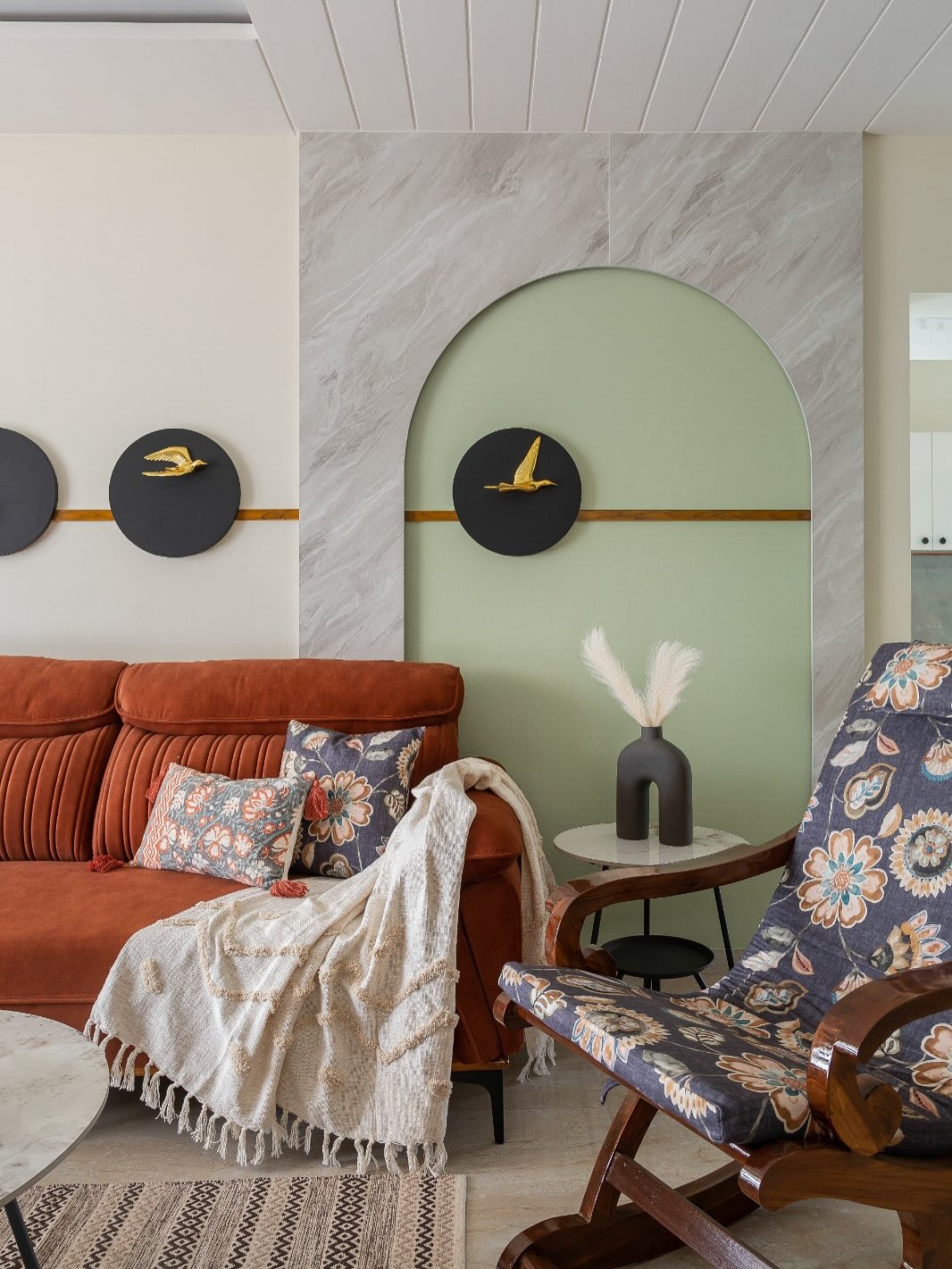 2. Soften Rust Seating With a Sage Arch