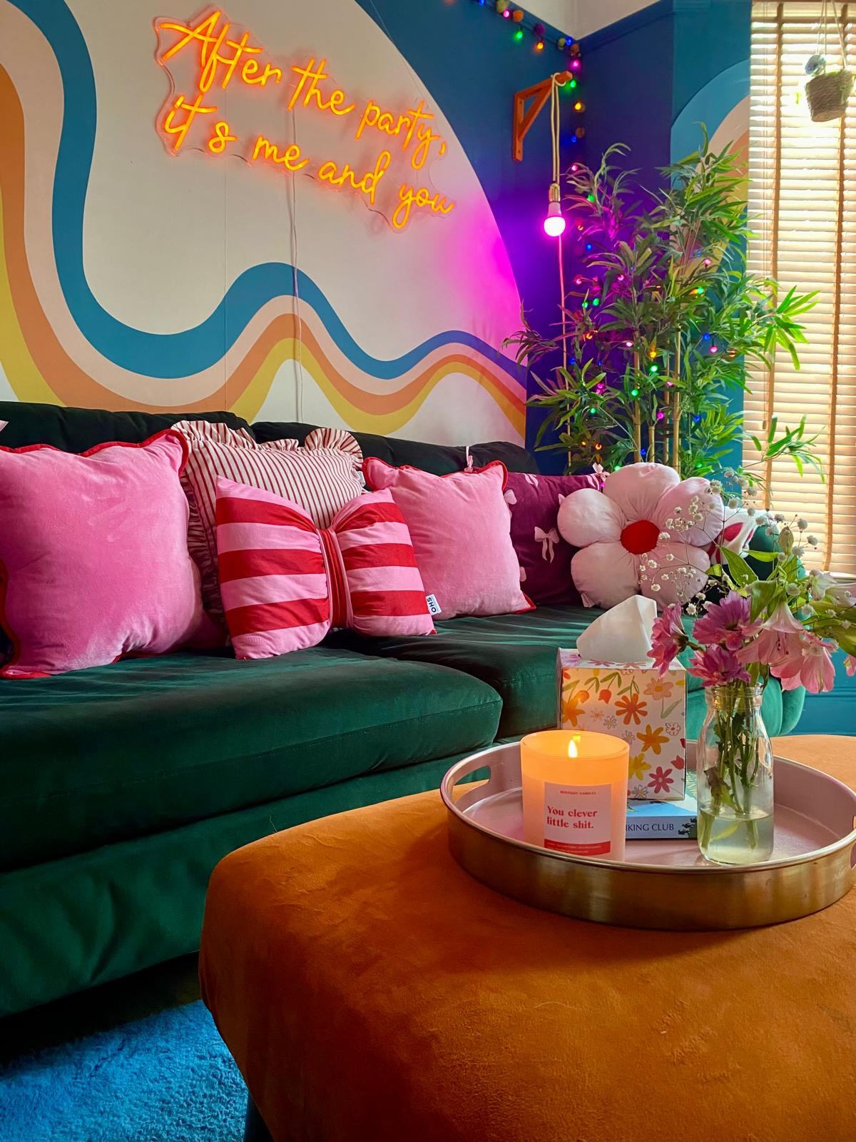 3. Pair a Green Sofa With an Orange Ottoman