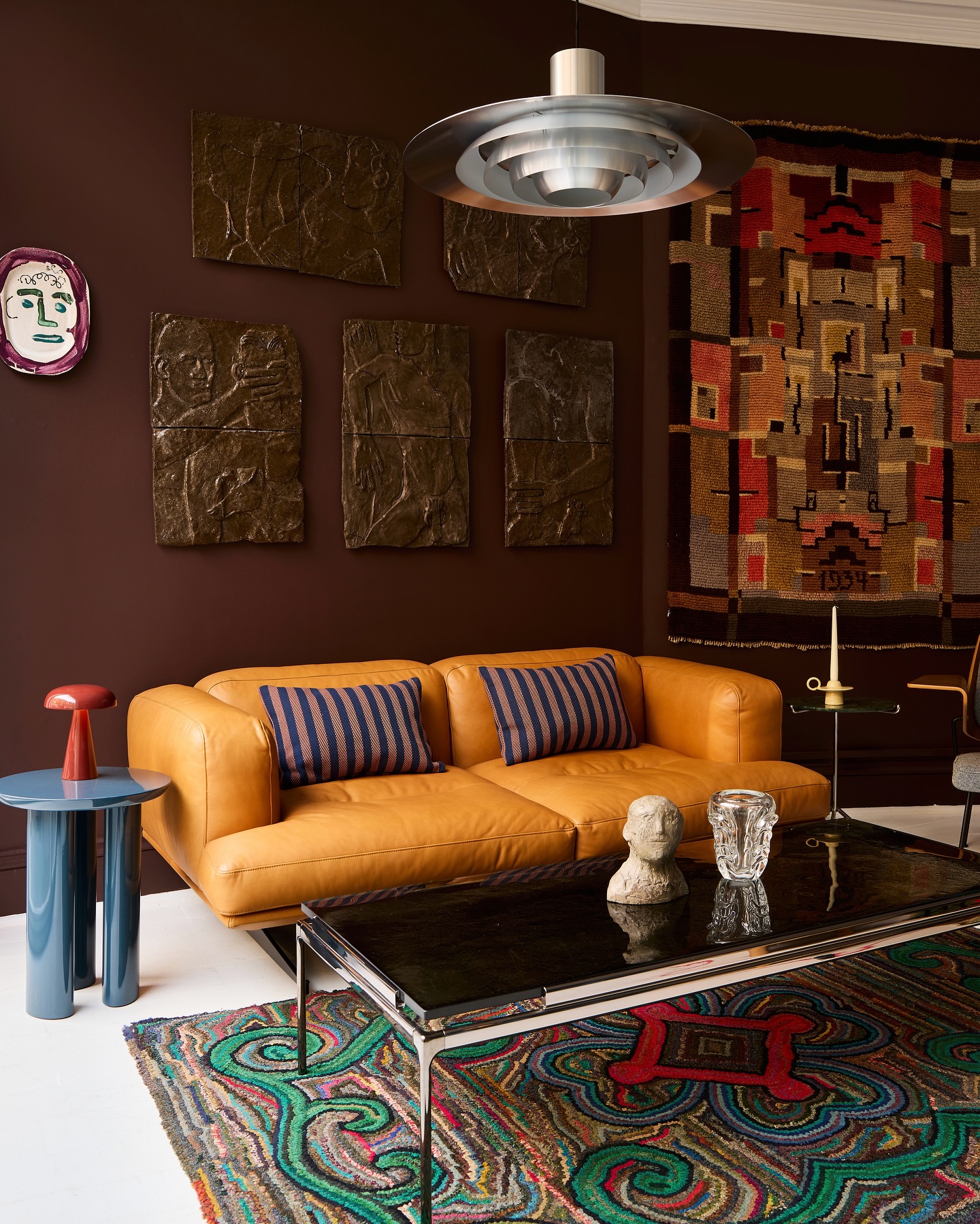 6. Ground Orange Seating With a Green Patterned Rug