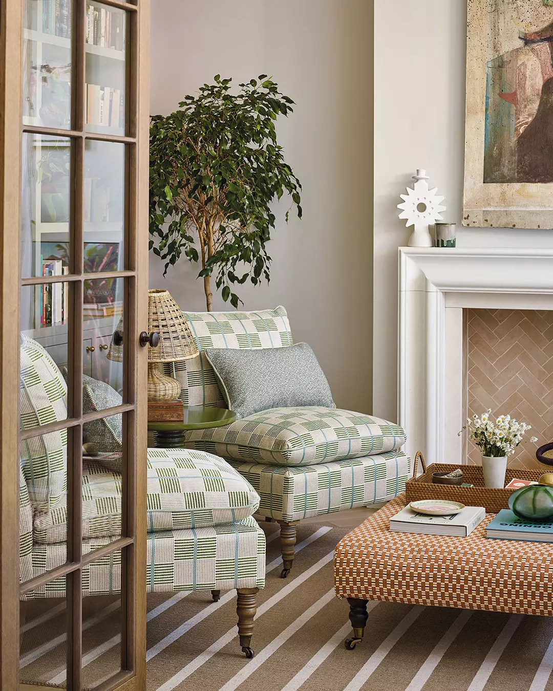 14. Mix Green Checks With an Orange Ottoman