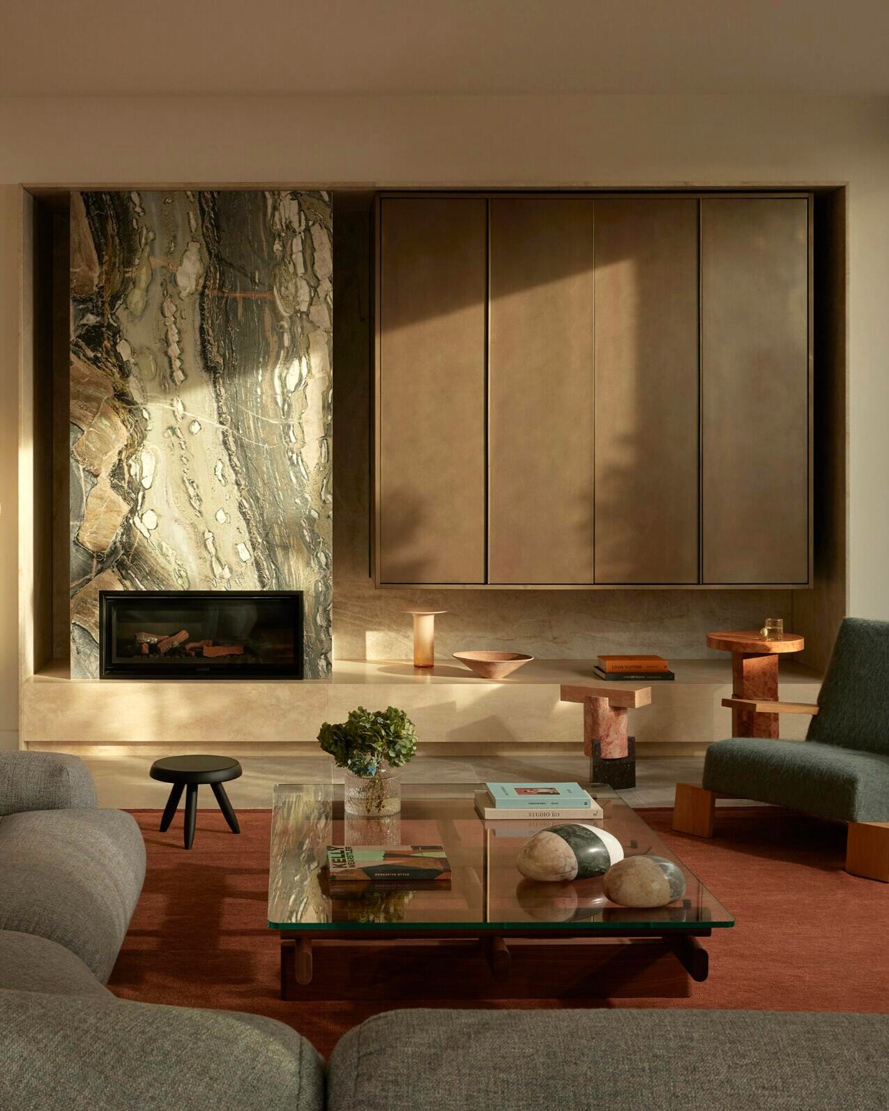 17. Ground a Green Stone Fireplace With a Rust Rug