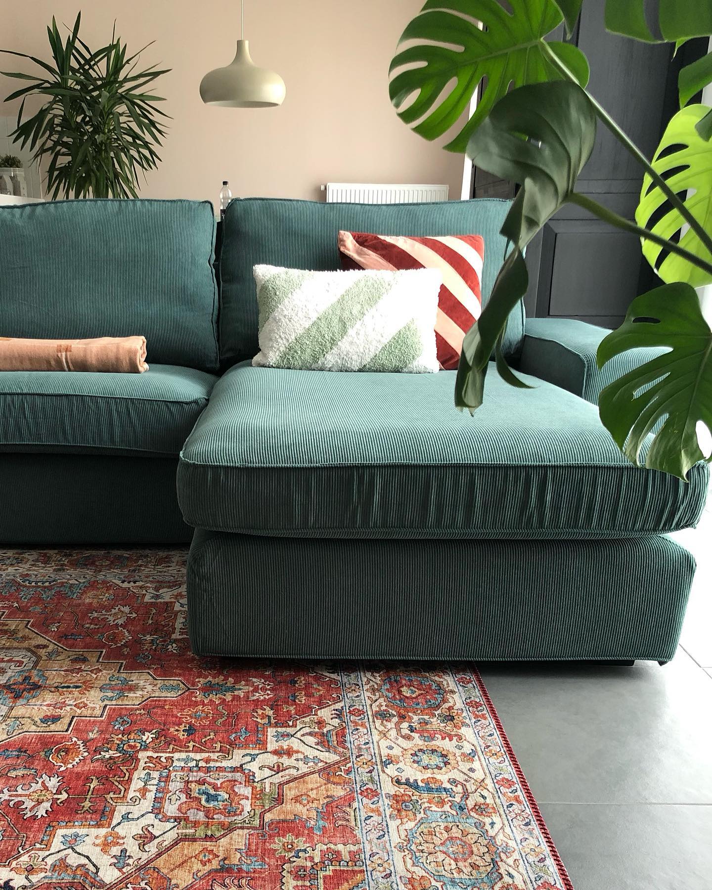 5. Give a Ribbed Green Couch a Vintage Rug